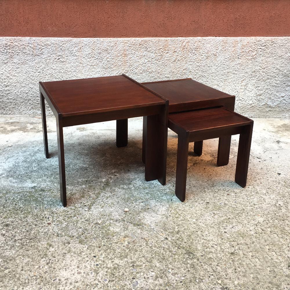 Set of three stackable tables mod.777 by Afra and Tobia Scarpa for Cassina, Italy, 1965
Structured in dark solid wood, with an original double side extraction of medium and small size table. When tables stay inside the bigger one they create a