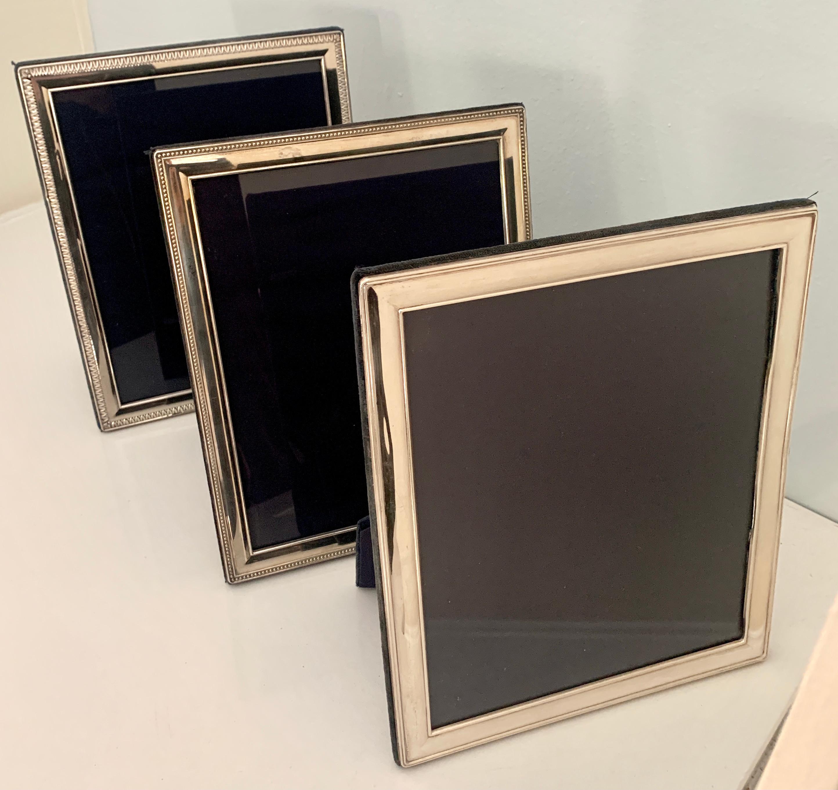 Polished Set of Three Sterling Silver Frames with Velvet Stand