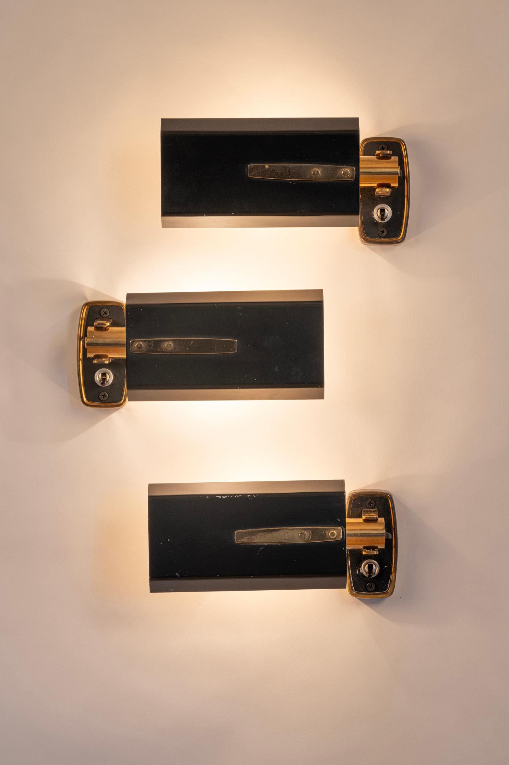 Set of three articulated Stilnovo wall lights.

Also available a near matching pair. 

Please ask if you would like to buy 5 as a set