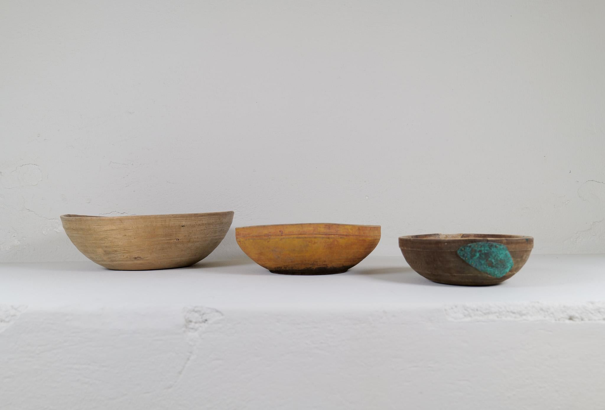 Set of 3 antique and unique three sizes organic wooden bowls. With highly appealing patina, with traces of use. Produced in Sweden, 19th century. 
These bowls where very important for many families; therefore, they were passed on from generations.