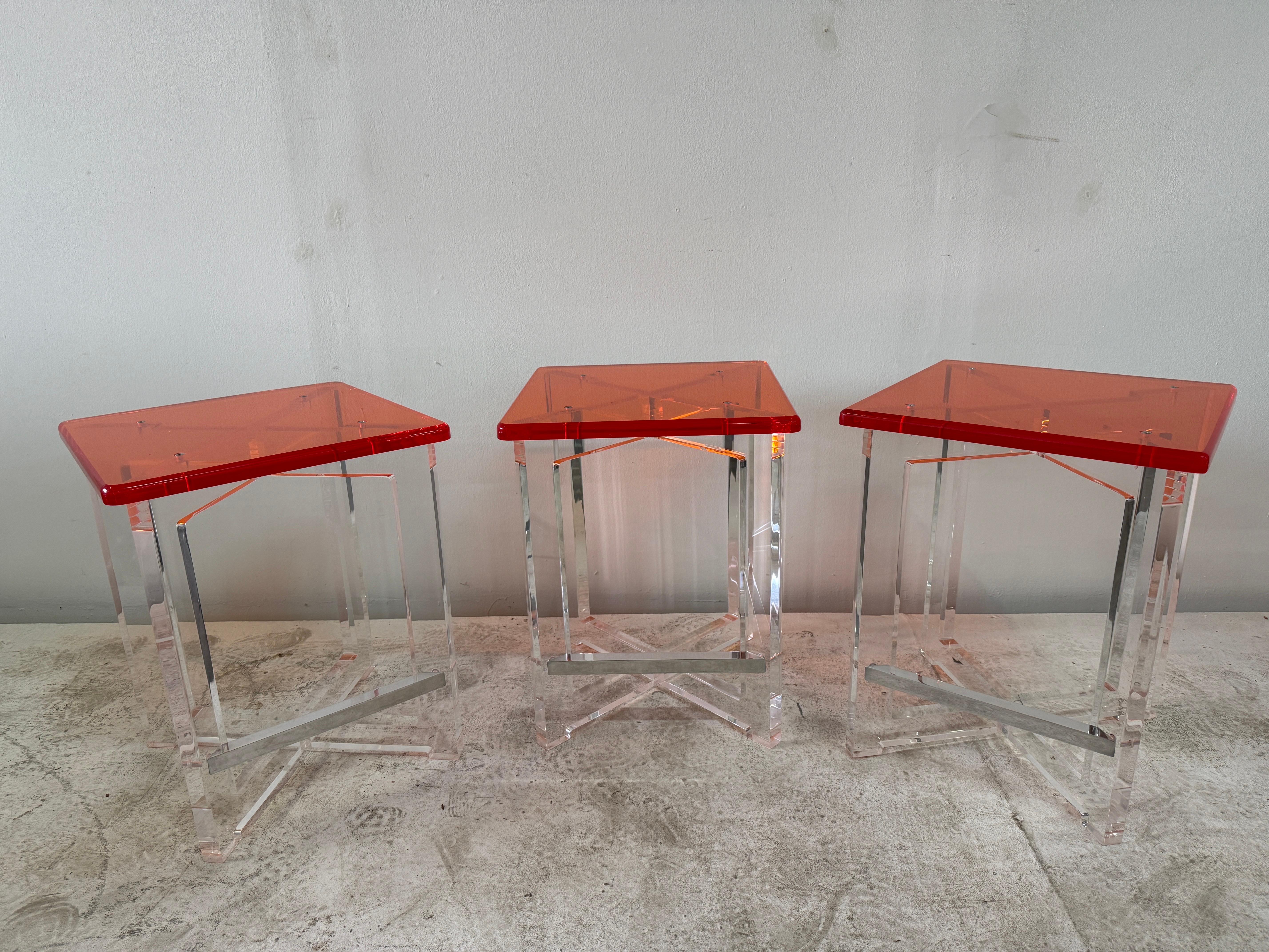 These extremely FUN orange acrylic top bar stools with clear acrylic base and steel footrest, are counter height or can be used for extra seating at a dining table as well.  Comfortable wide seat top and heavy, well made.