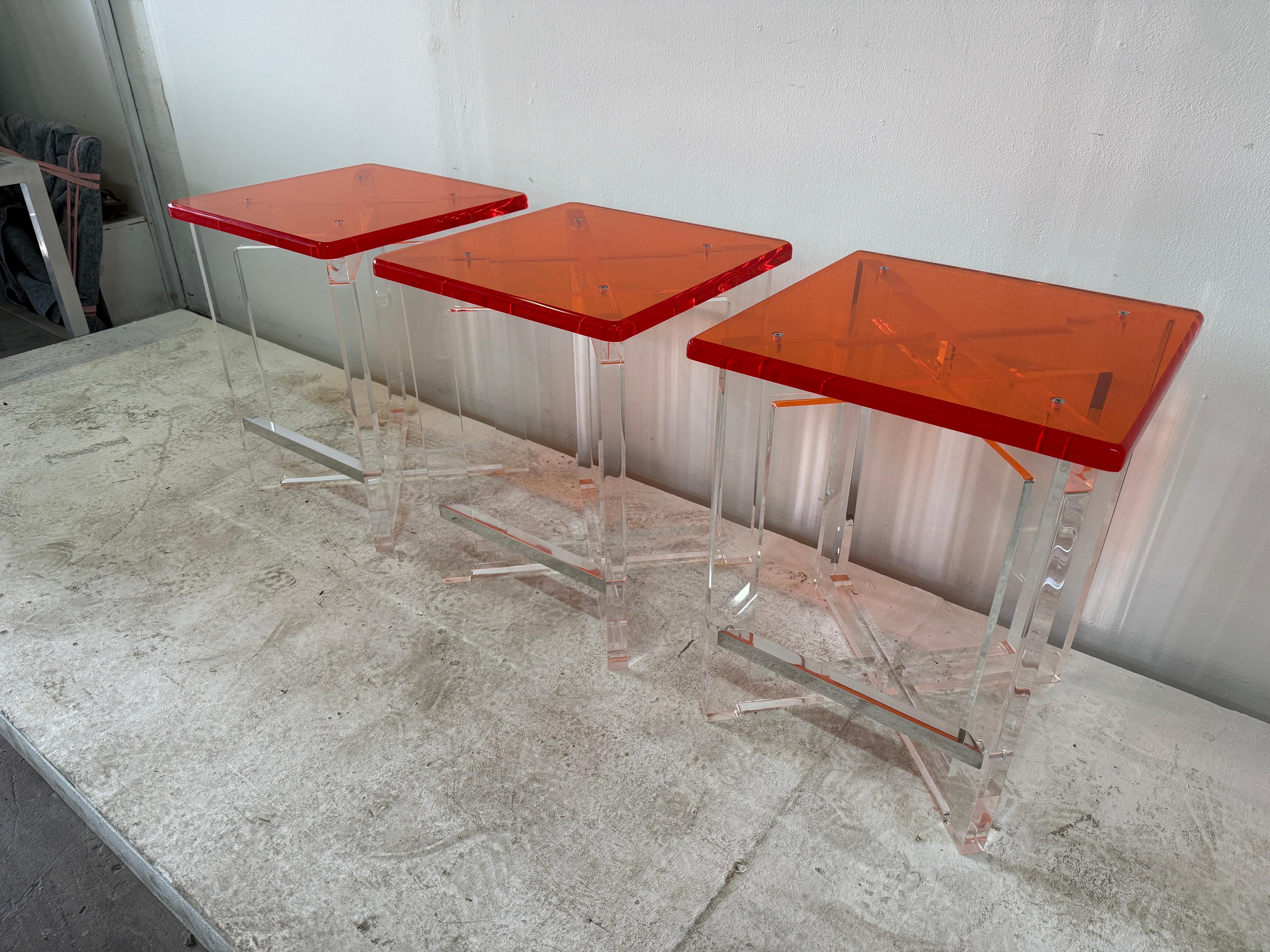 Late 20th Century Set of Three Thick Orange & Clear Acrylic Counter Height Bar Stools For Sale
