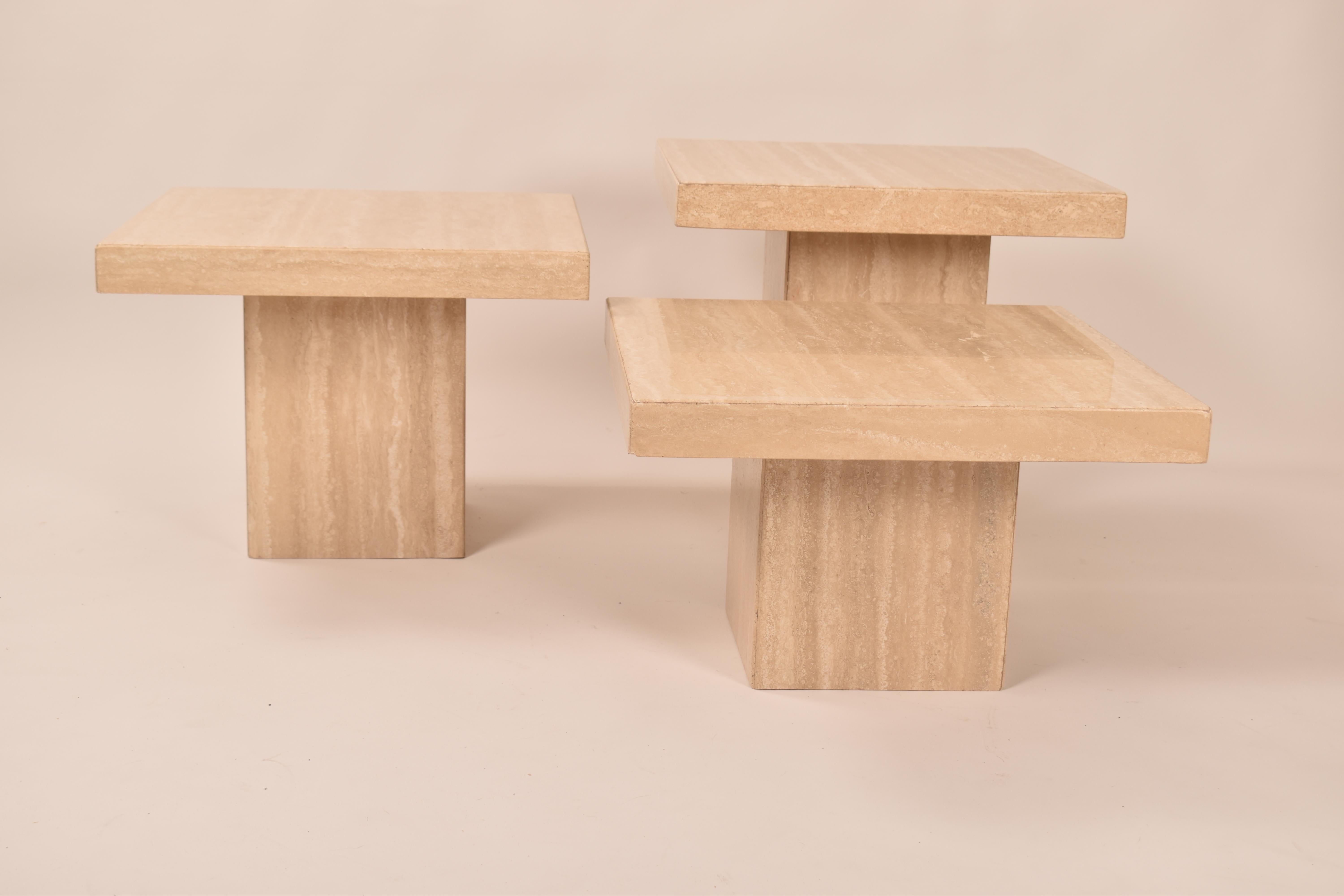 Set of three tiered square coffee tables, made of honed travertine with square table tops and bases. 
Group them together as a coffee table, or spread them out as side tables. 
The varying heights allow them to be arranged in any configuration