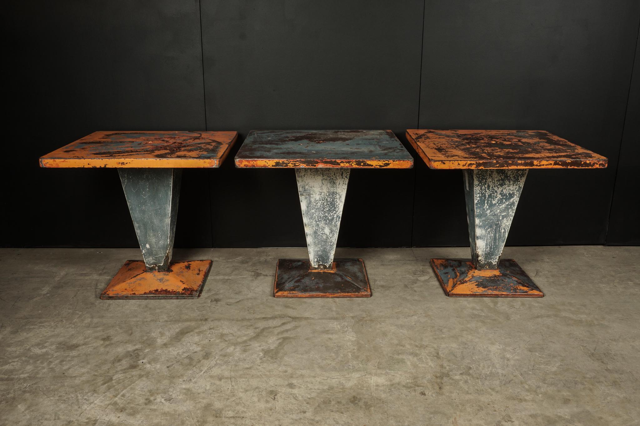 Set of three Tolix Bistro tables with original paint from France, circa 1950. Solid construction with superb original color and wear.