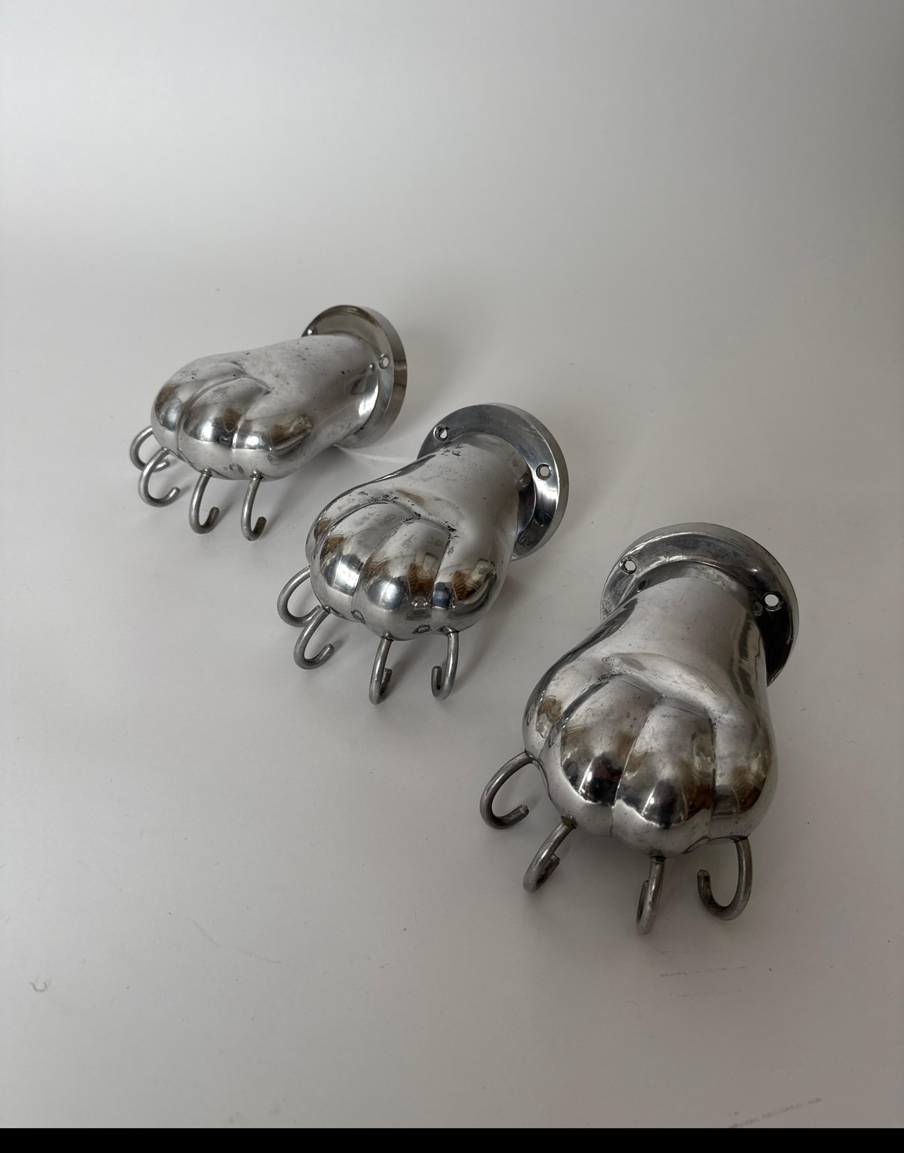 Exceptionally beautiful towel holders made of polished cast aluminum. The towel holders are mounted directly on the wall with the help of two screws, the wall plate is made of polished aluminum. The lion's paw is minimalistic and modern and is made