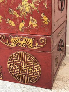 Set of three travel trunks with red lacquered, circa 1940.