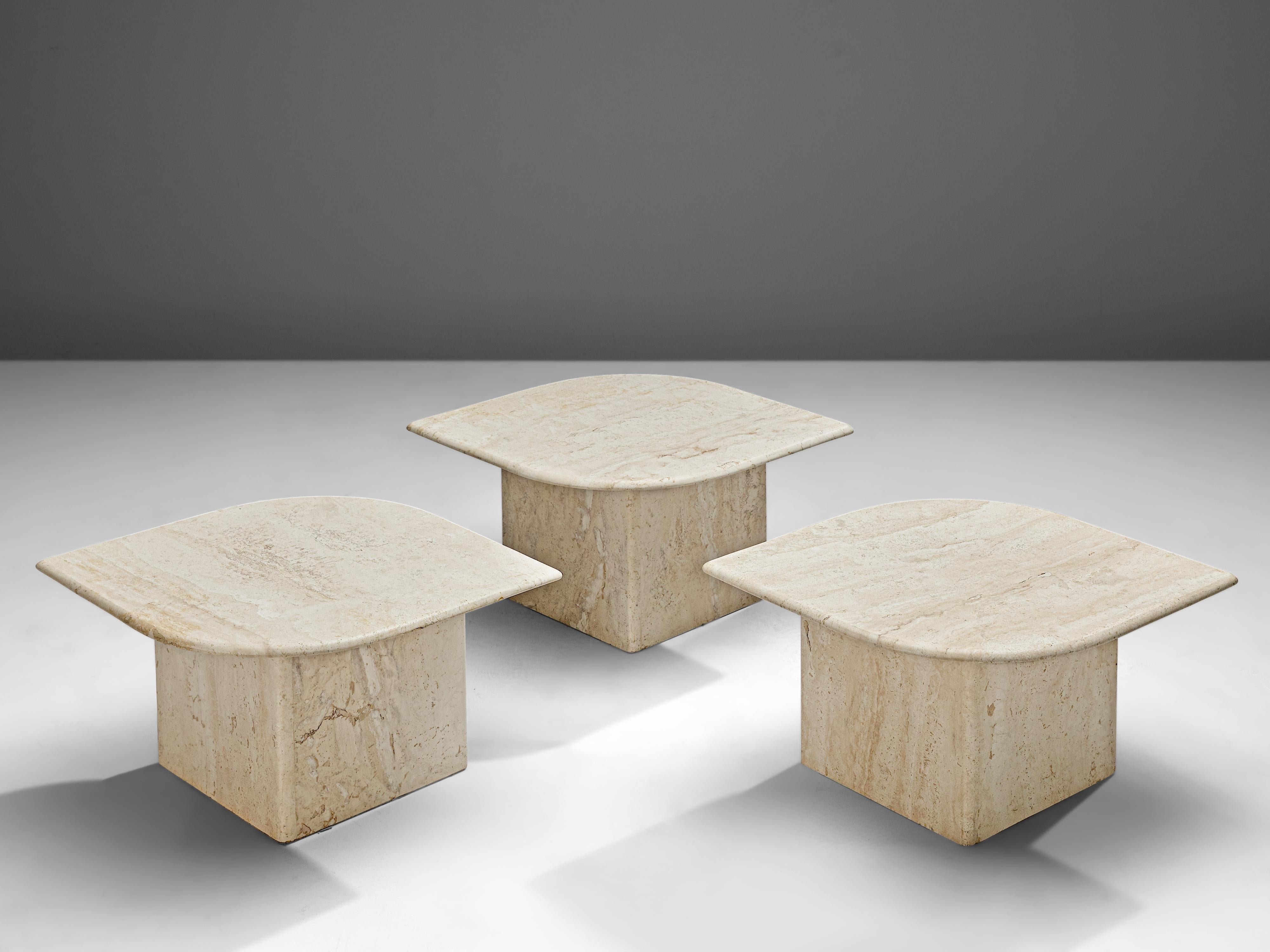 Set of three coffee tables, travertine, Italy, 1970s

These coffee tables feature an eye-shaped travertine tabletop on a L-shaped base. Depending on the way how you place the tables the base either gives the impression to be a block or the true