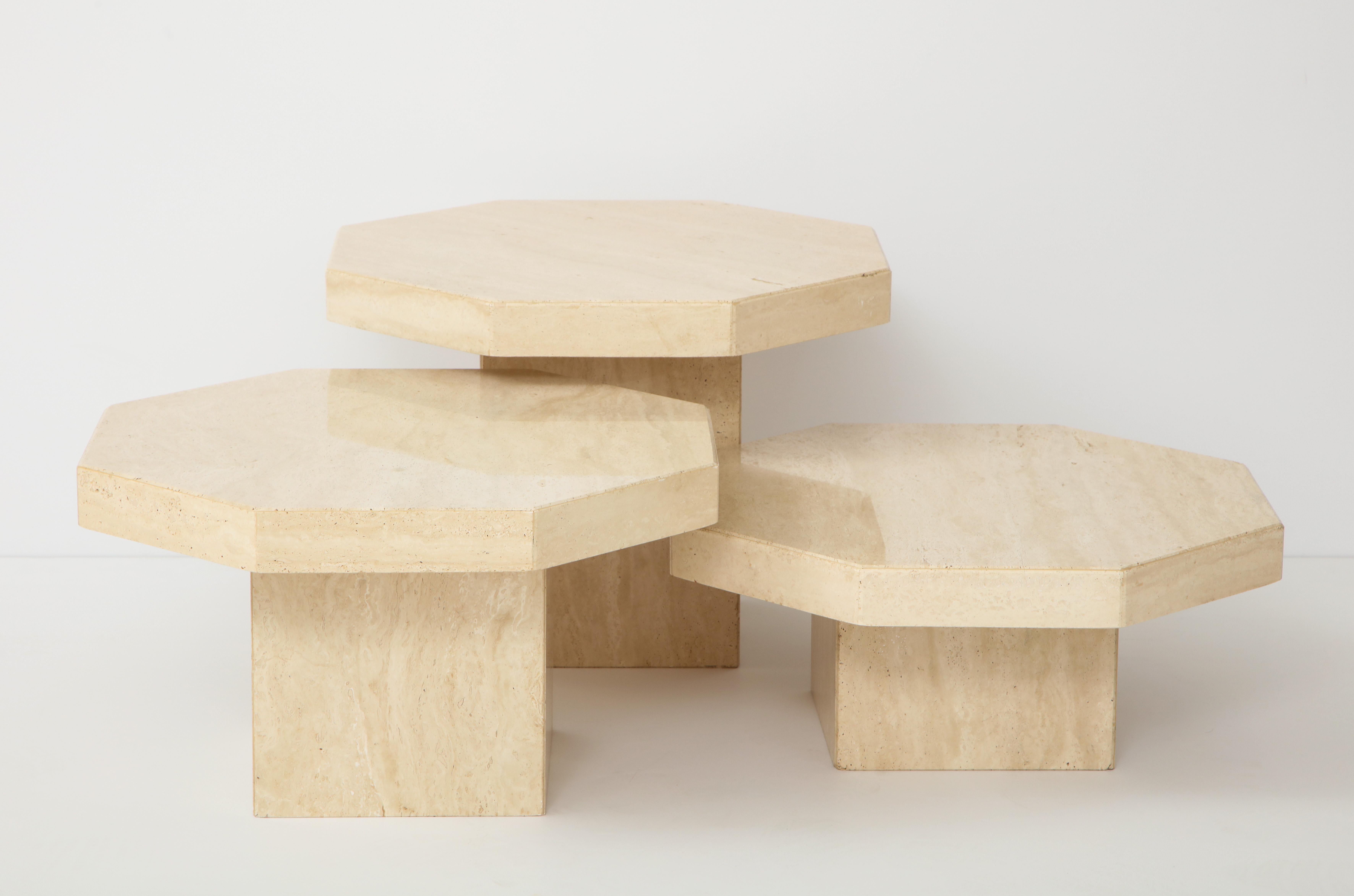 Set of three 1970s Italian travertine nesting tables.
The octagonal polished tops are All the same size
with the bases varying in height so that they can be arranged in various configurations.
Tallest 15