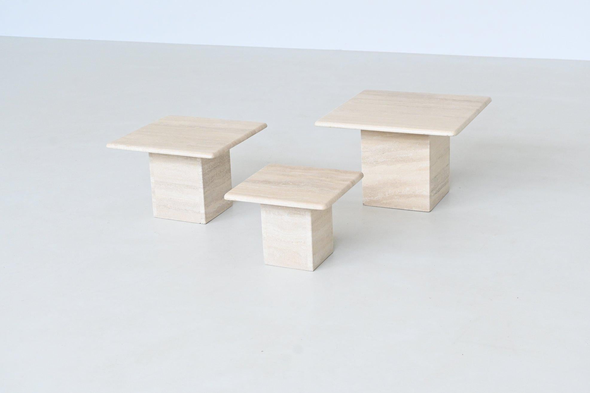 Beautiful set of three travertine stone nesting tables, Italy 1970. This stylish and versatile set is crafted from ivory-toned travertine with richly patterned surfaces that highlight the natural elegance of the stone. Designed with subtle