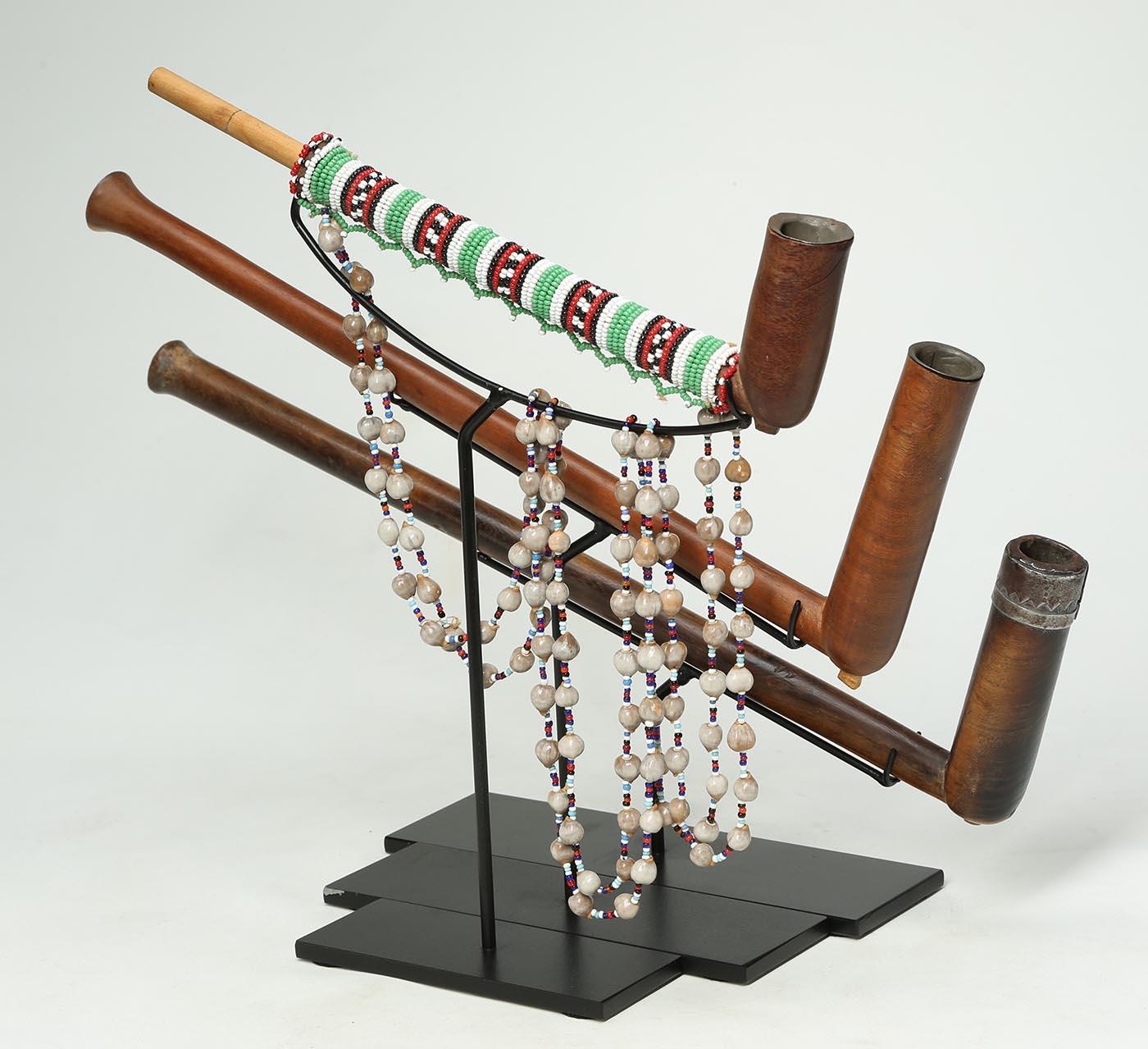 Hand-Carved Set of Three Tribal Zulu Wood Pipes on Stands, South Africa