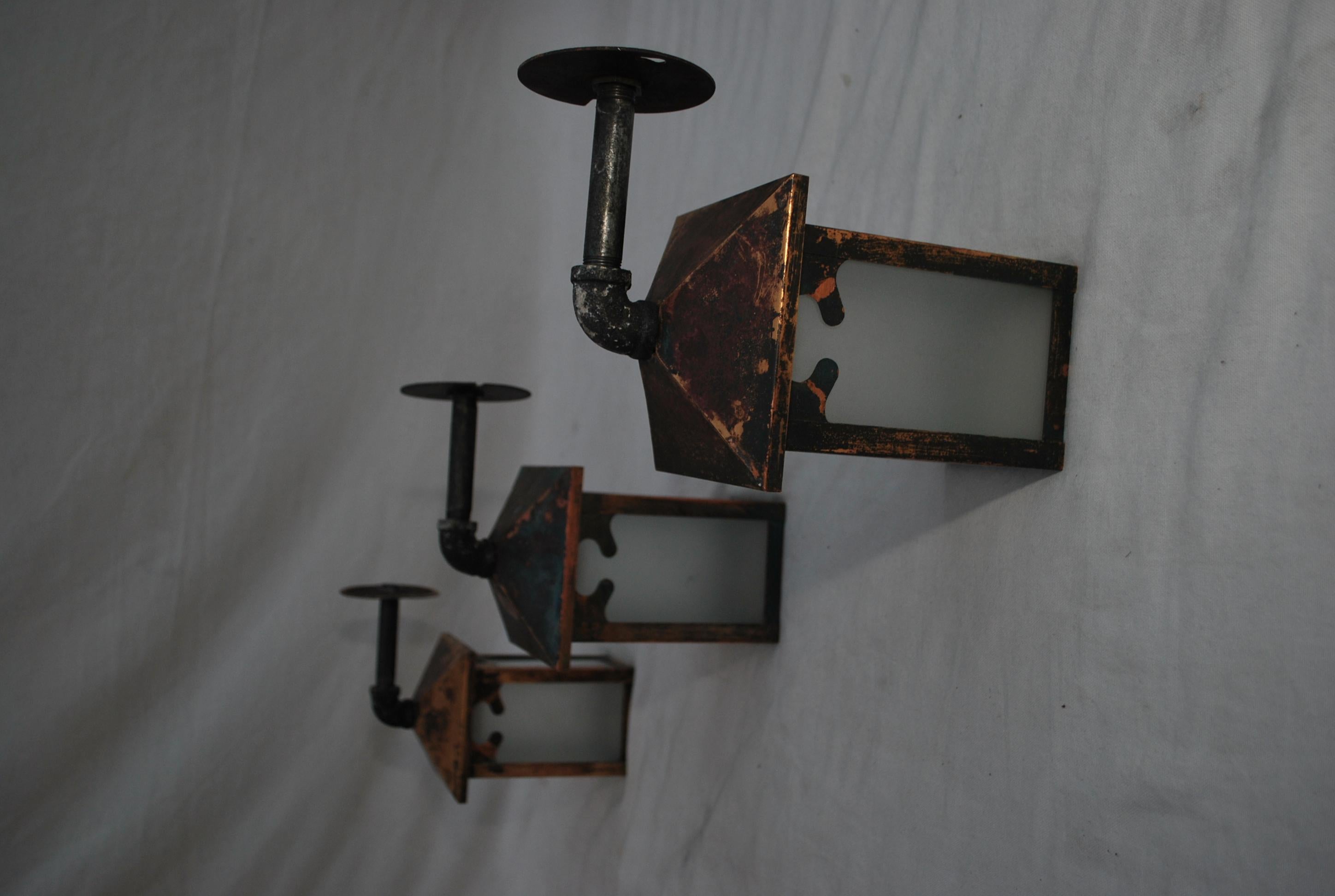 Arts and Crafts Set of three turn of the century copper outdoor sconces