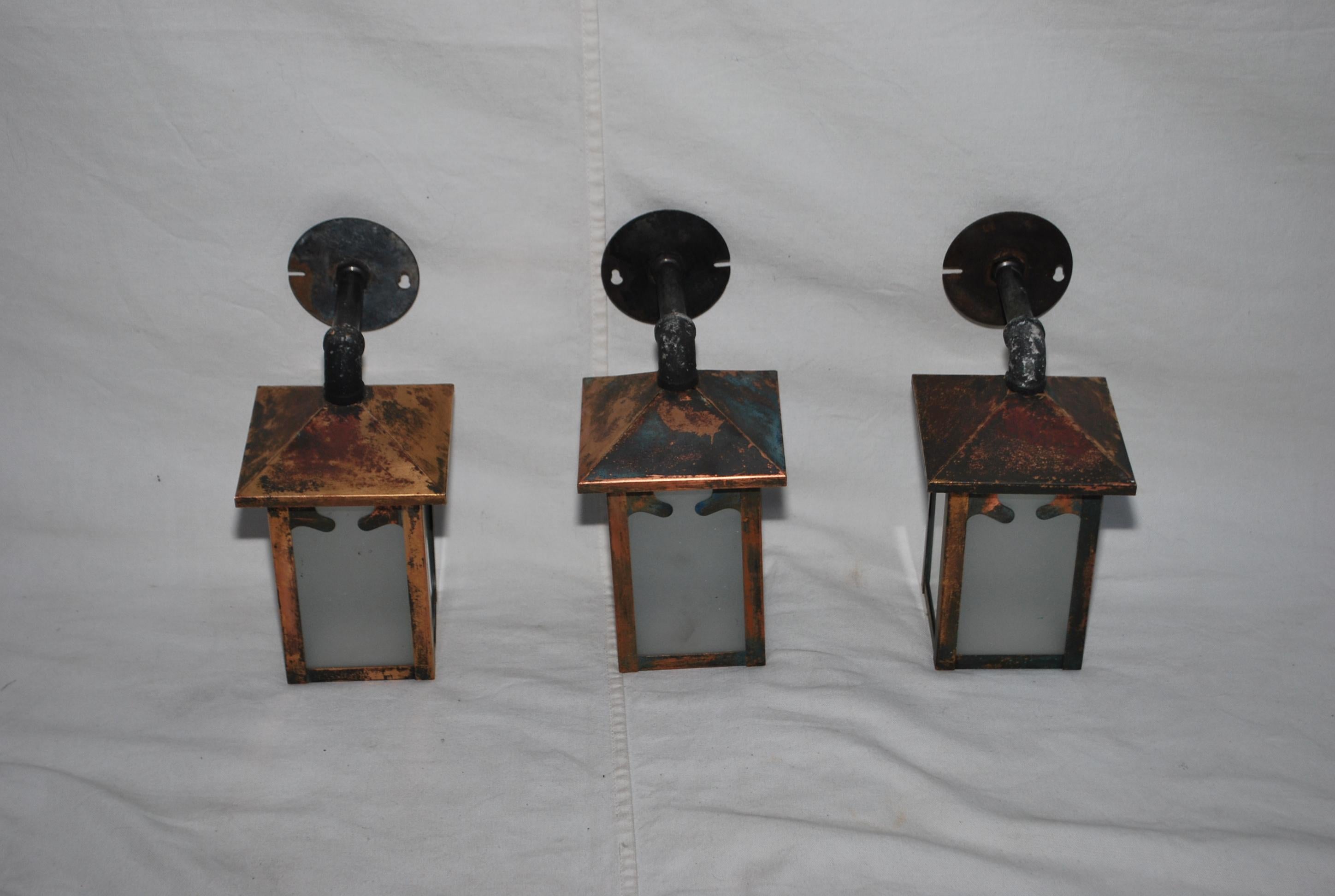 American Set of three turn of the century copper outdoor sconces