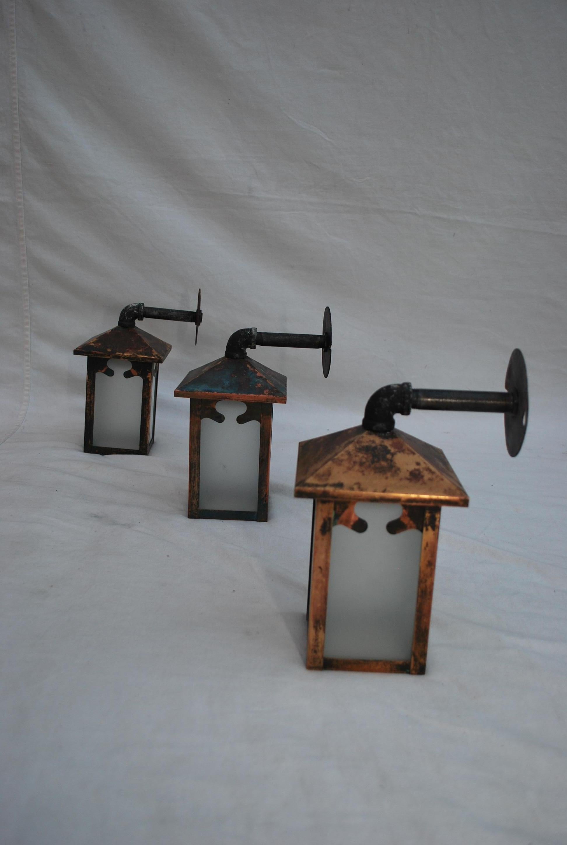 Early 20th Century Set of three turn of the century copper outdoor sconces