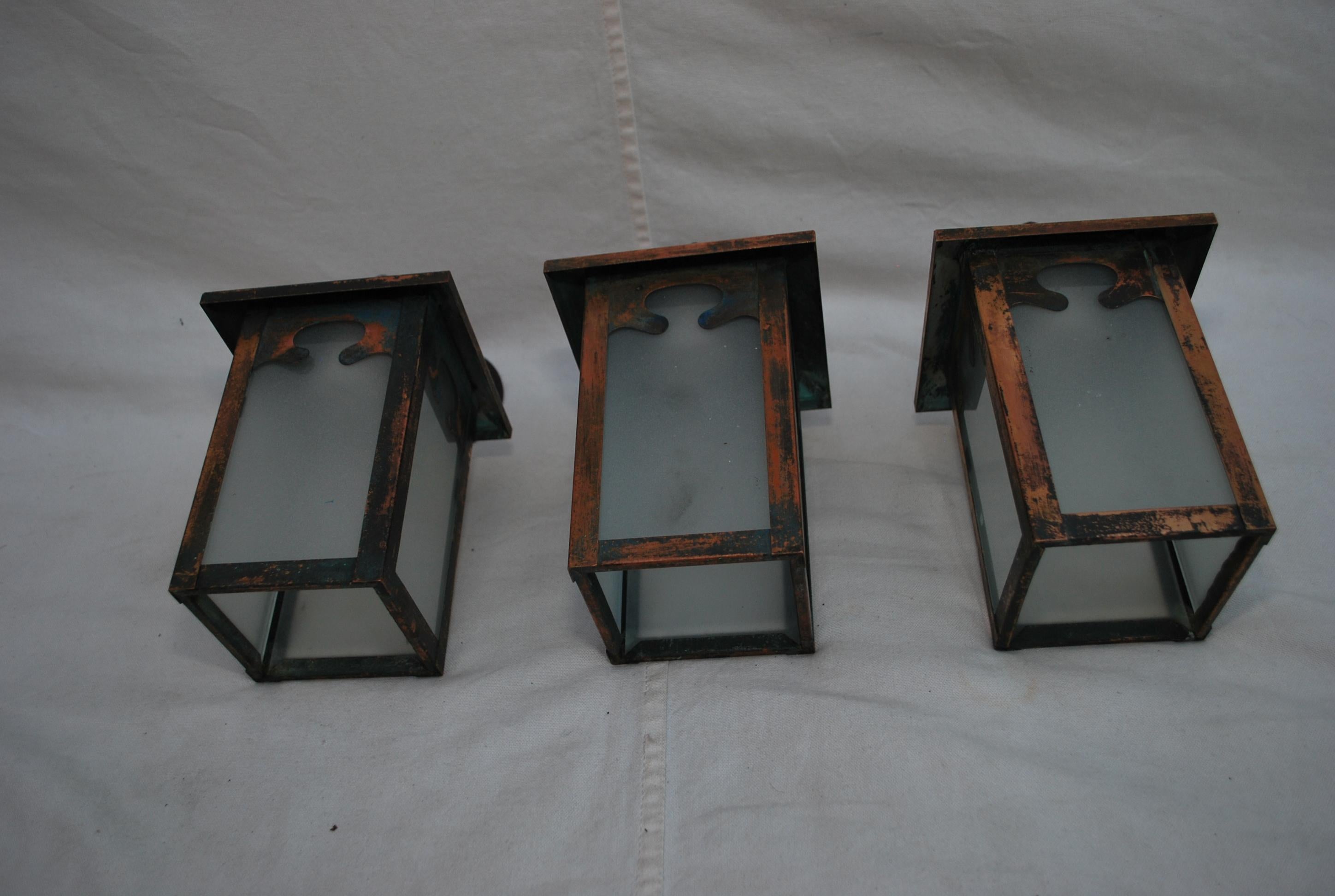 Set of three turn of the century copper outdoor sconces 1
