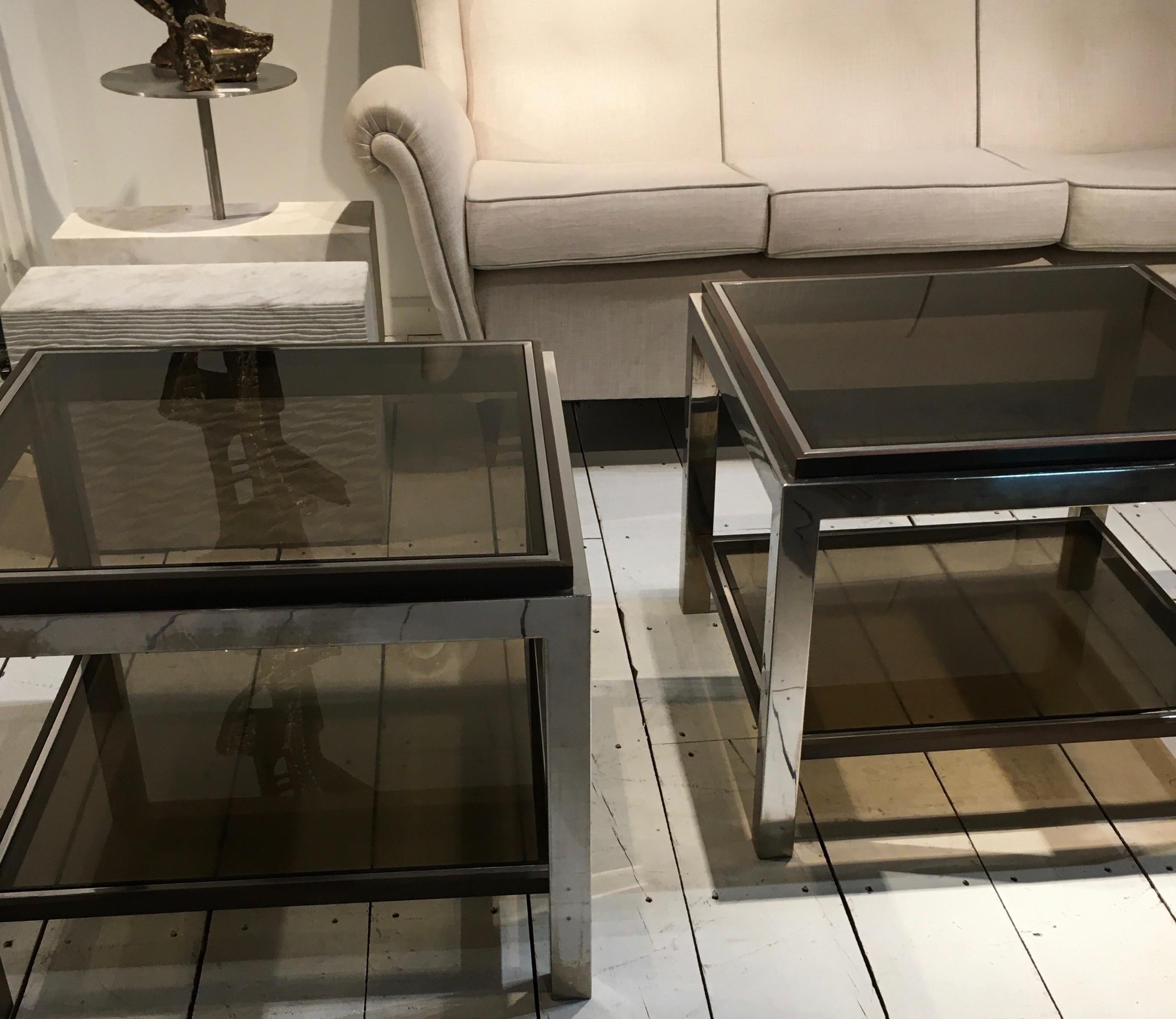 Set of three tables (one large square coffee table and two square
side tables)
Chrome and gunmetal finish metal with smoked glass tops.
Flaminia Linea.
By Willy Rizzo, France, 1970.