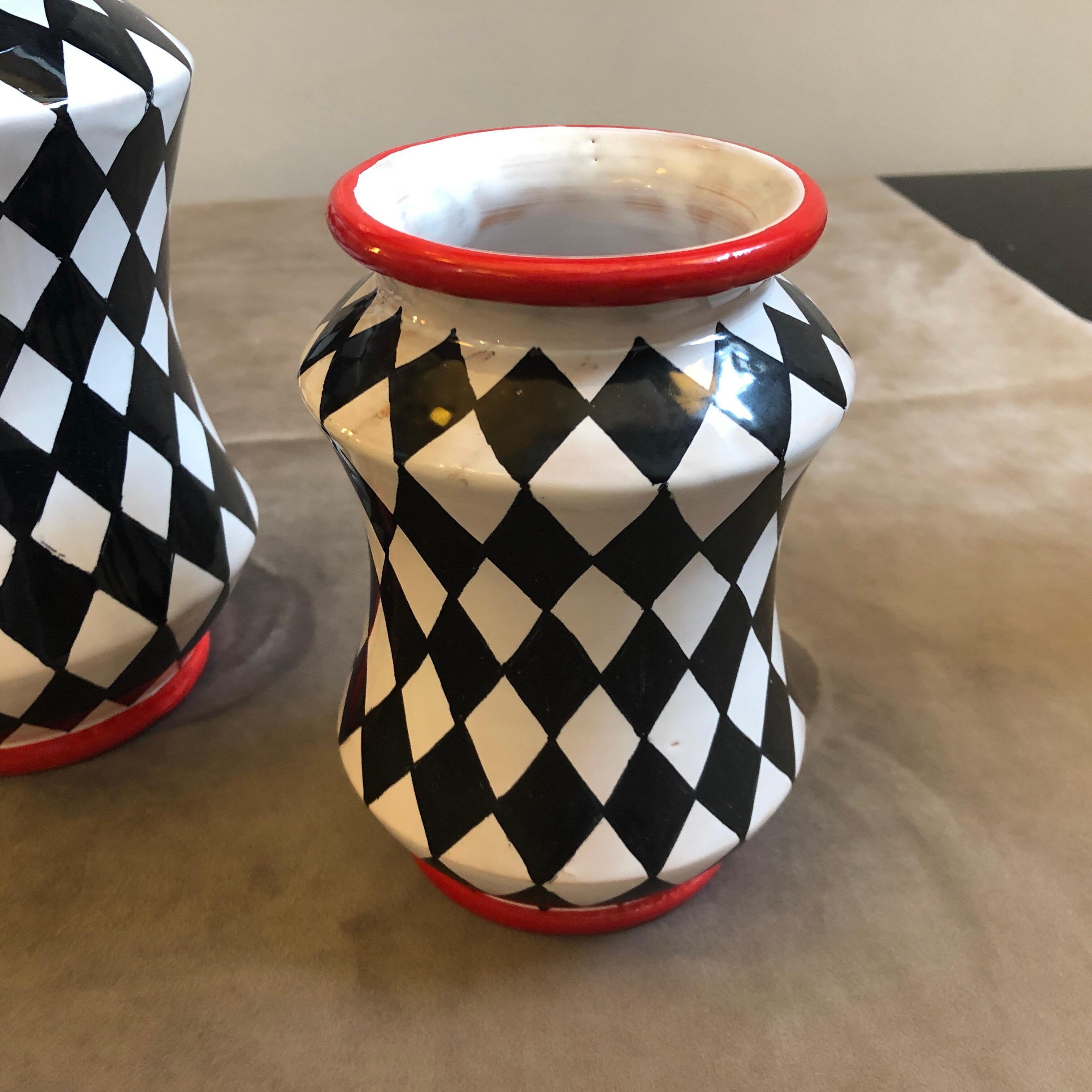 Three hand painted terracotta vases made in Sicily, they are unique pieces especially made for our shop and signed on the bottom. In the past, the Albarello vase was made to contain medical herbs
Dimensions: Medium vase height 21 cm, small vase