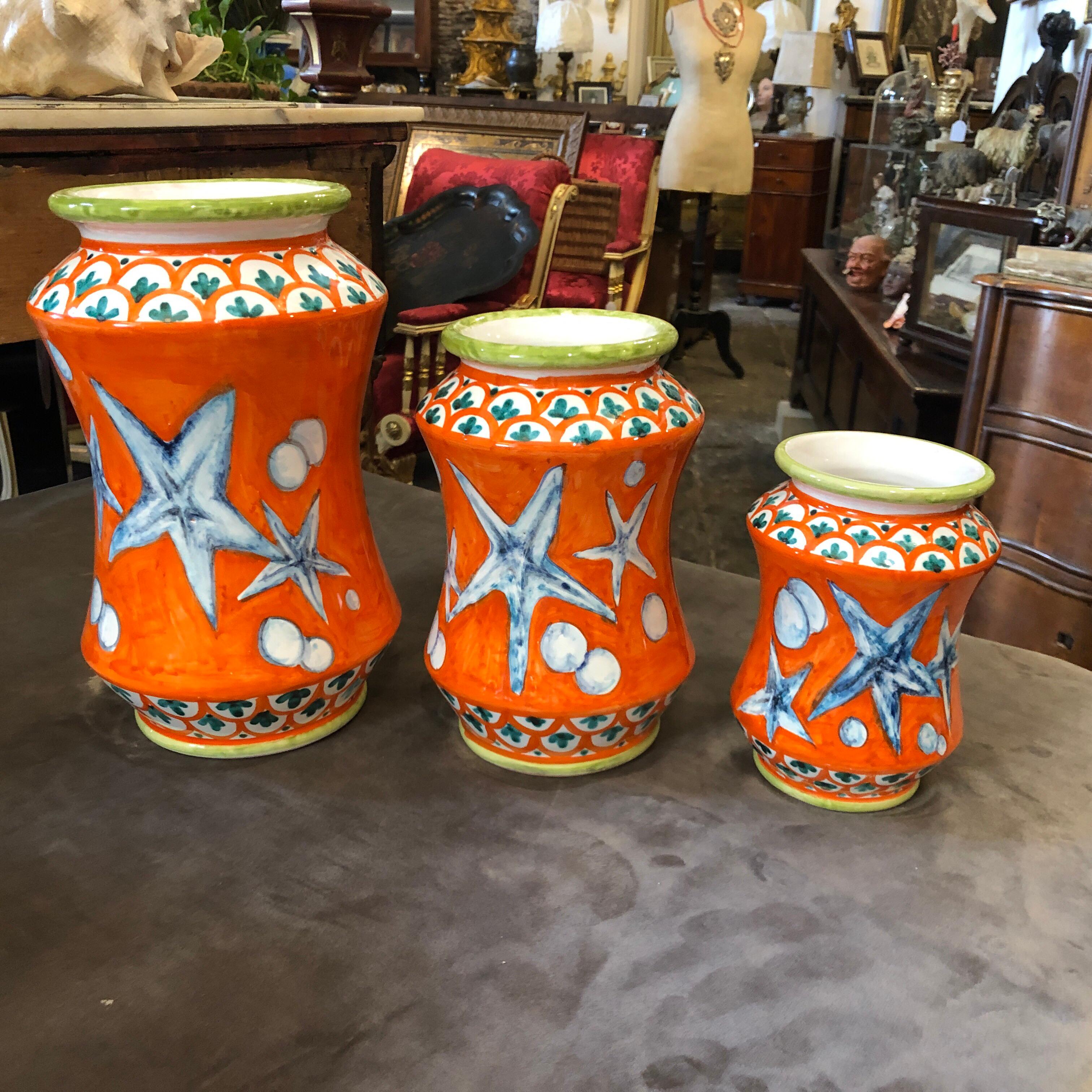 Three traditional pharmacy vases totally handcrafted and painted with sea decor. They are unique pieces especially made for our shop.