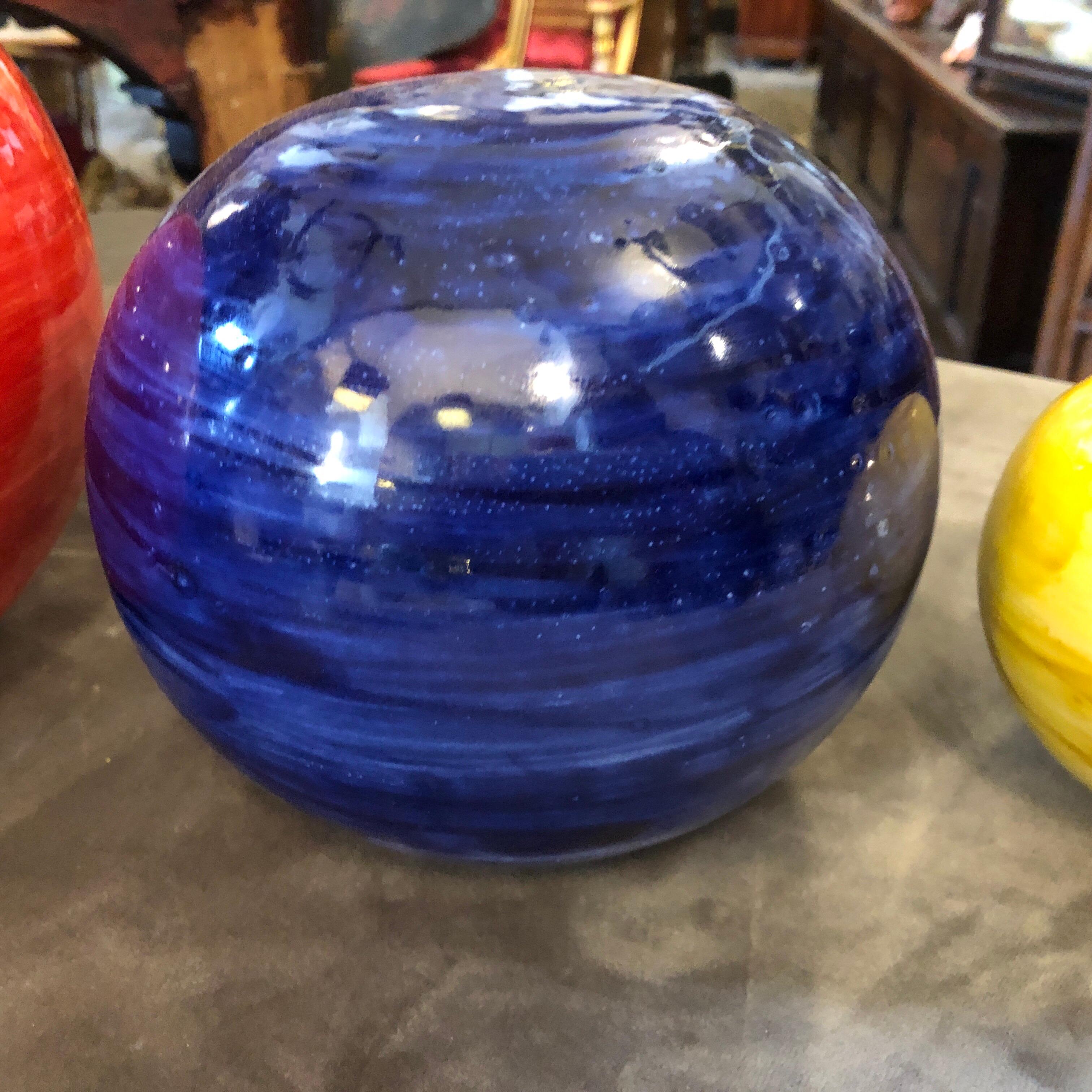 Three spheres made in Sicily, in the small town of Caltagirone, world famous for handcrafted ceramics. They are especially made for our store and are unique pieces. Diameter of the medium sphere is 14 cm, the small one is 9 cm diameter.