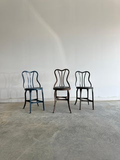 Set of three varying UHL patinated metal cafe bistro dining chairs