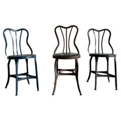 Vintage Set of three varying UHL patinated metal cafe bistro dining chairs