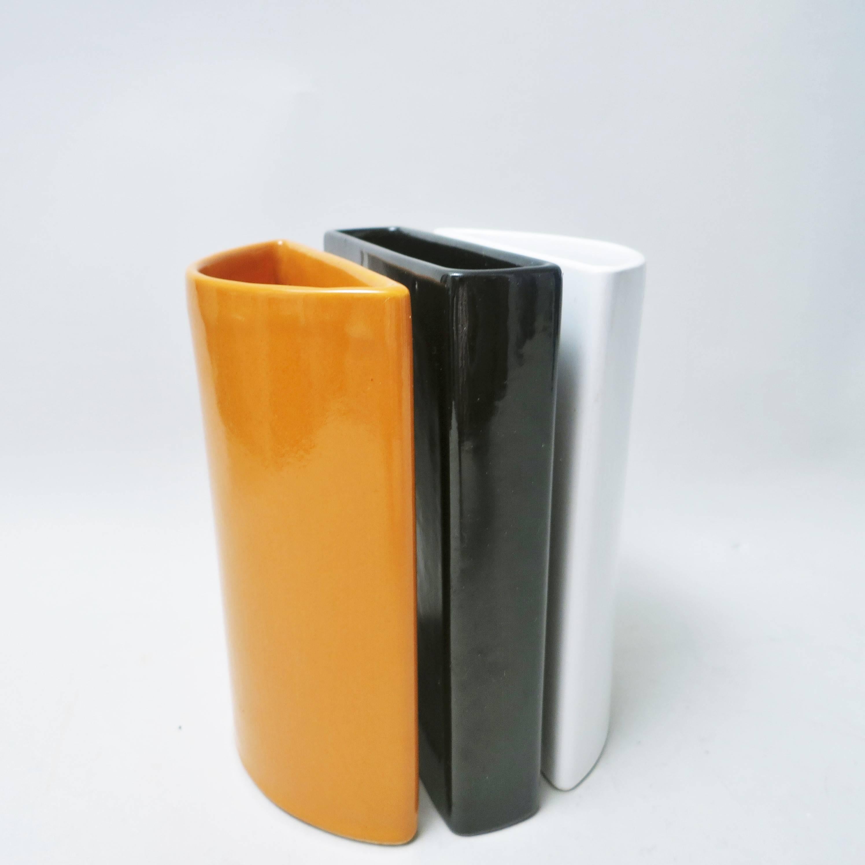 Set of three vases to be combined designed by Italian architect Aldo Cotti for Tronconi in 1970 in ceramic enameled white, black and camel. 
Stamped under the vase with a T.