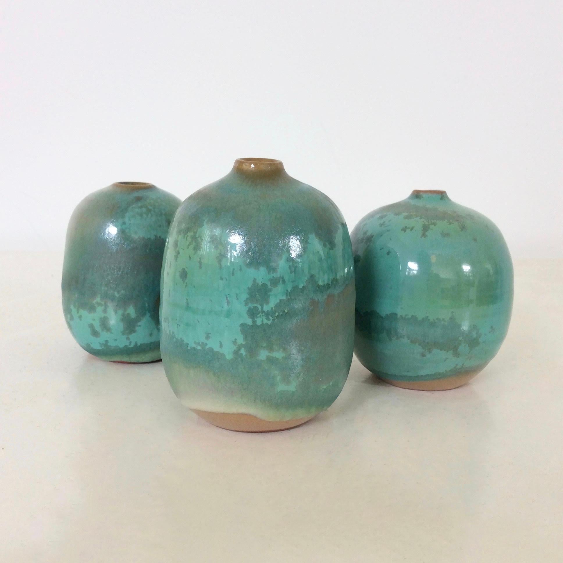 Nice set of three vases by Antonio Lampecco, Belgium, circa1980.
Green glazed ceramic, signed underside.
Dimensions: 7 cm Height, diameter 5 cm.
Good condition.