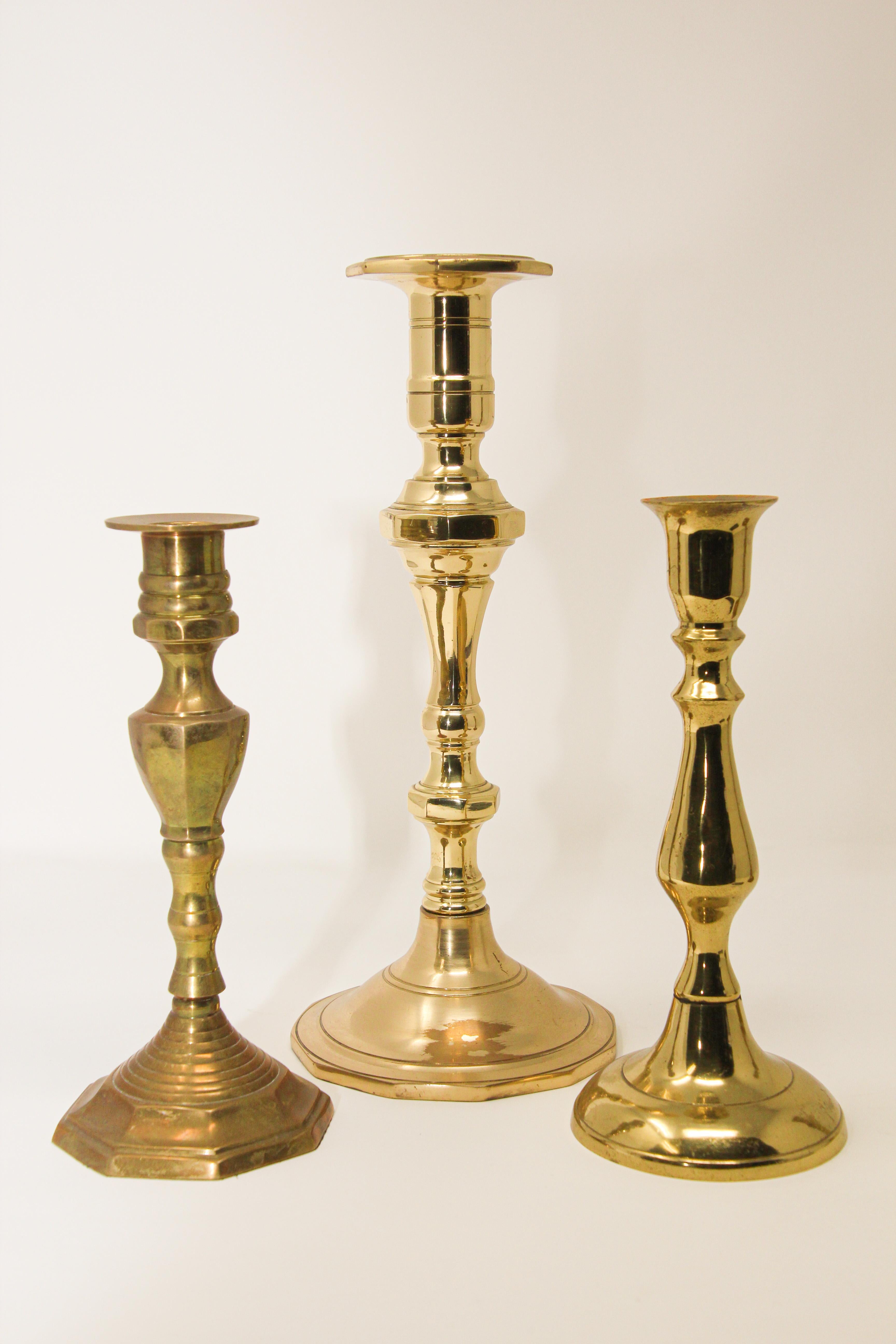 Set of three Victorian brass polished candlesticks.
19th century hand-tooled brass candlesticks.
Handcrafted Victorian brass candle sticks, candleholders, finely handcrafted.
Measures: 
Large: 11