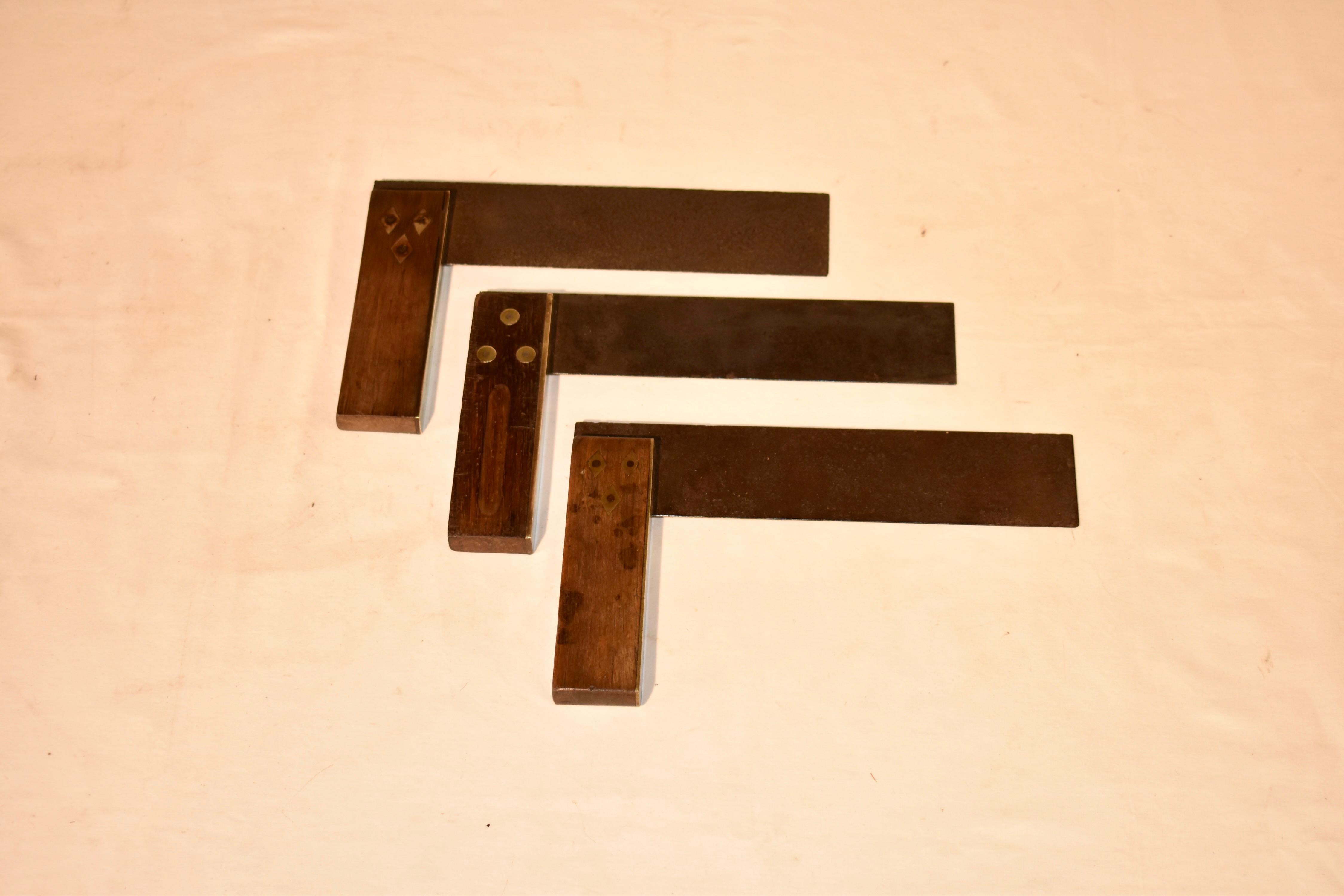 This is a set of three antique shipwright's set squares. The squares are made from rosewood and have brass caps.  They are right-angled tools, dating to the Victorian period, circa 1880.  Quality, antique craftsman's tool.  There are lovely brass