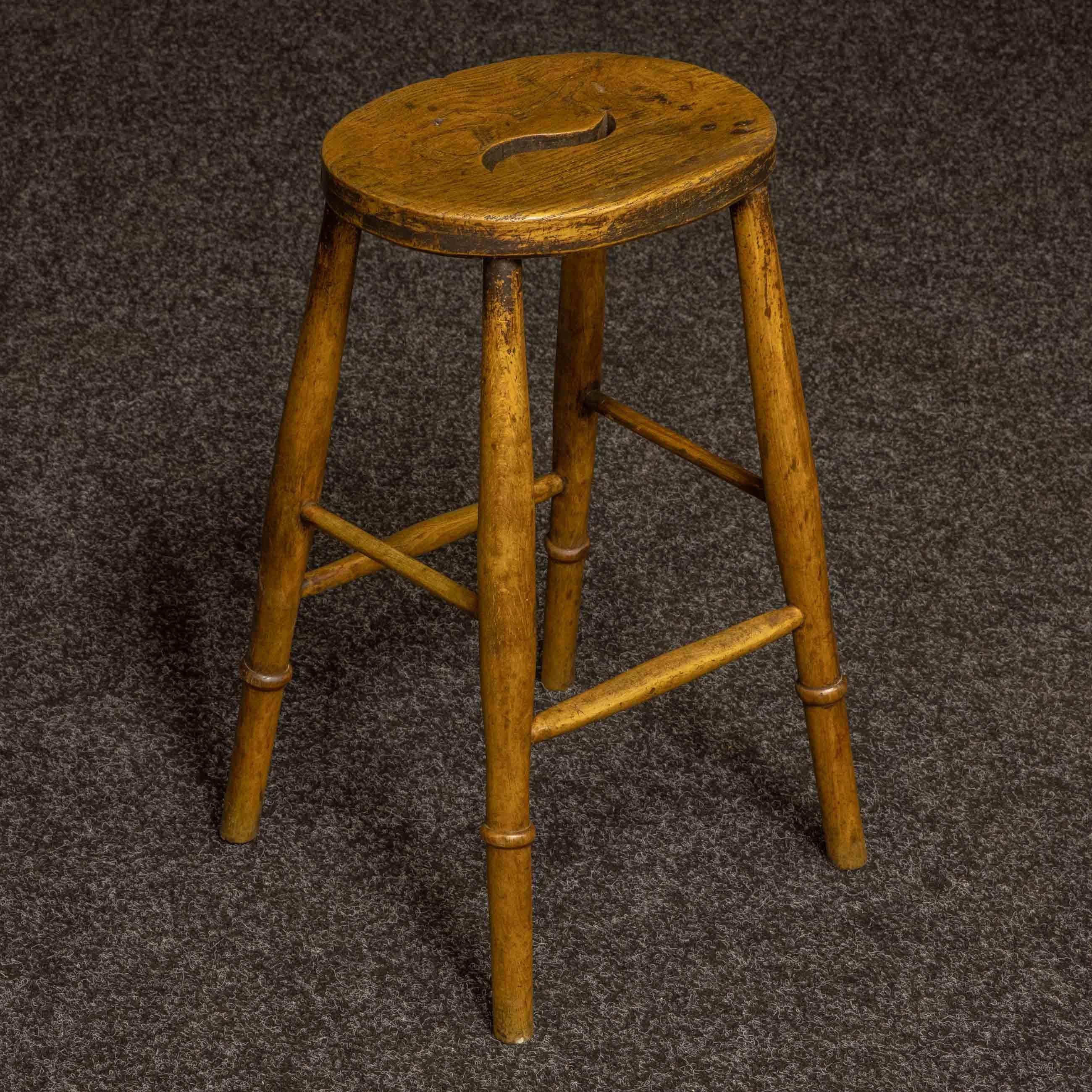 A good set of three Victorian stools with beautiful elm seats and curved hand grips.