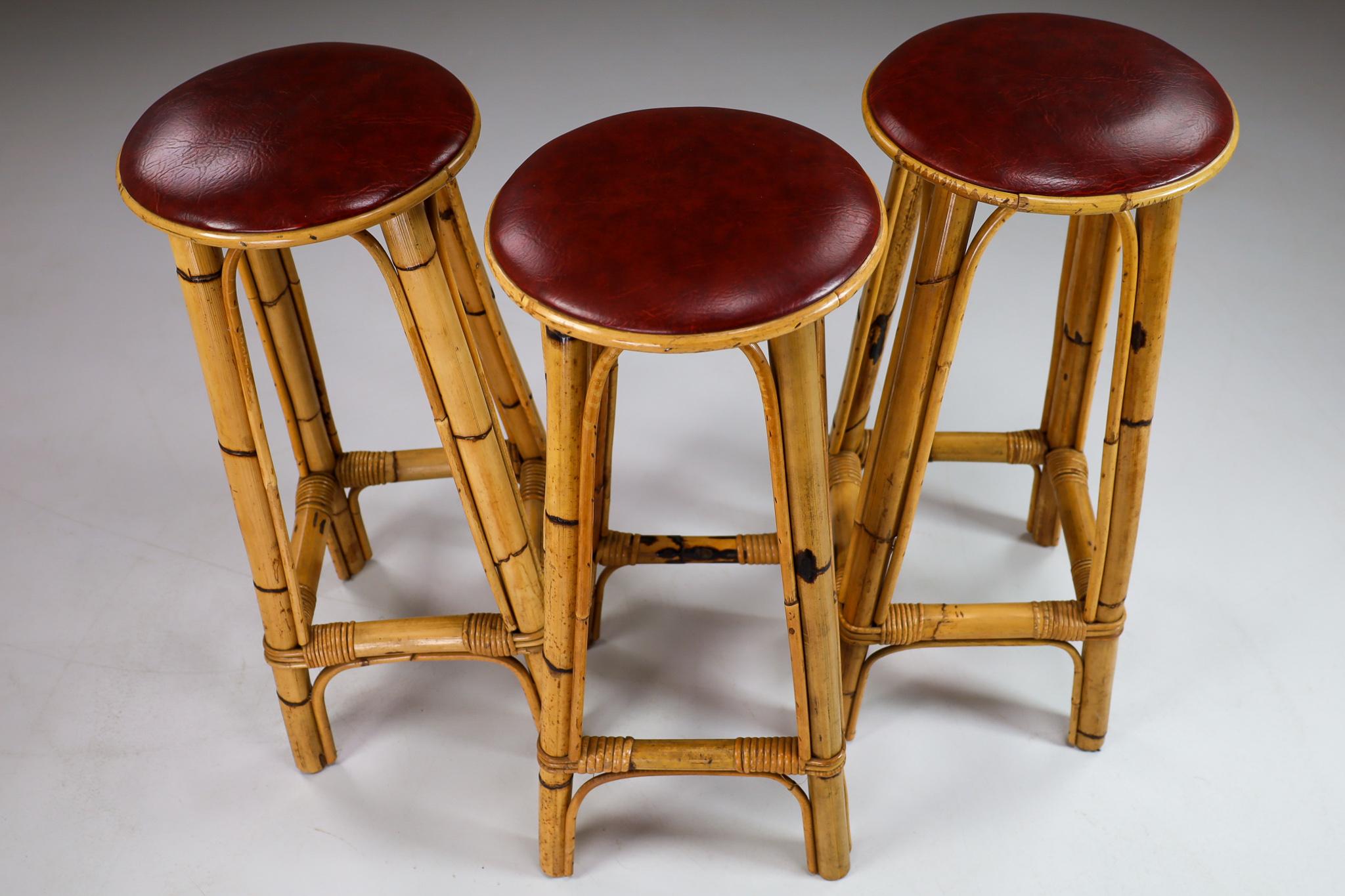 Set of Three Vintage Bamboo Barstools with Red Leather Seat, France, 1950s In Good Condition In Almelo, NL