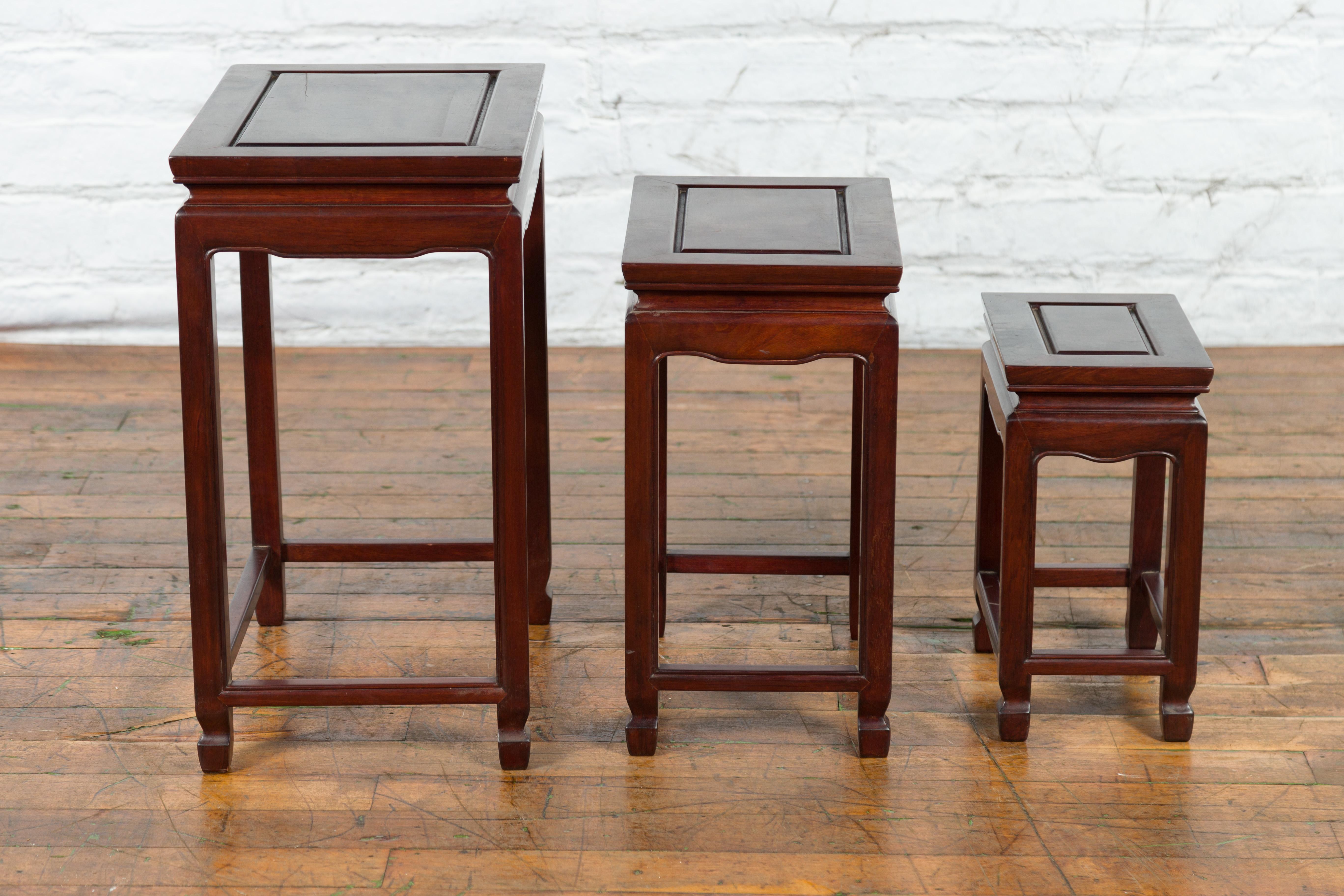 Carved Set of Three Vintage Chinese Rosewood Nesting Tables with Dark Patina For Sale