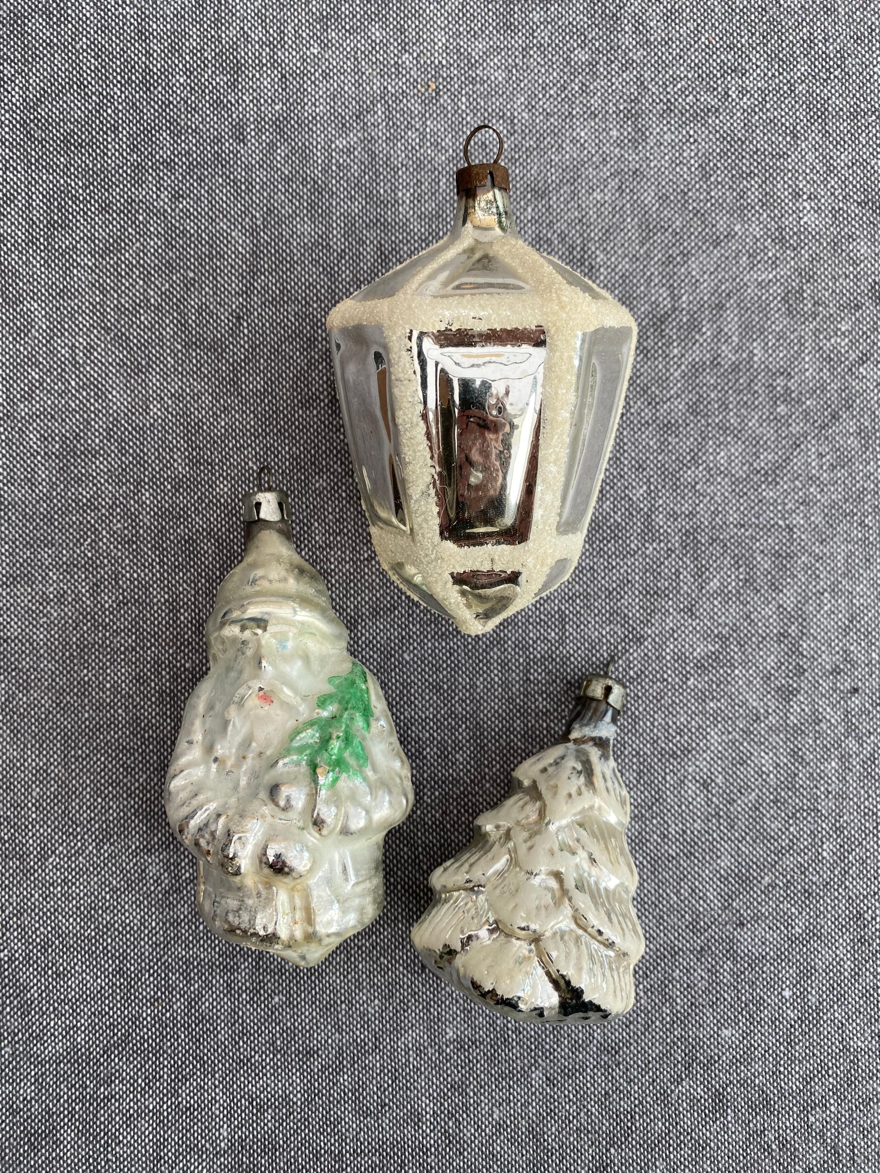 Set consists of three glass pieces; 1 Santa Claus, one Christmas tree and one Lantarn. Measurements are from the biggest one.