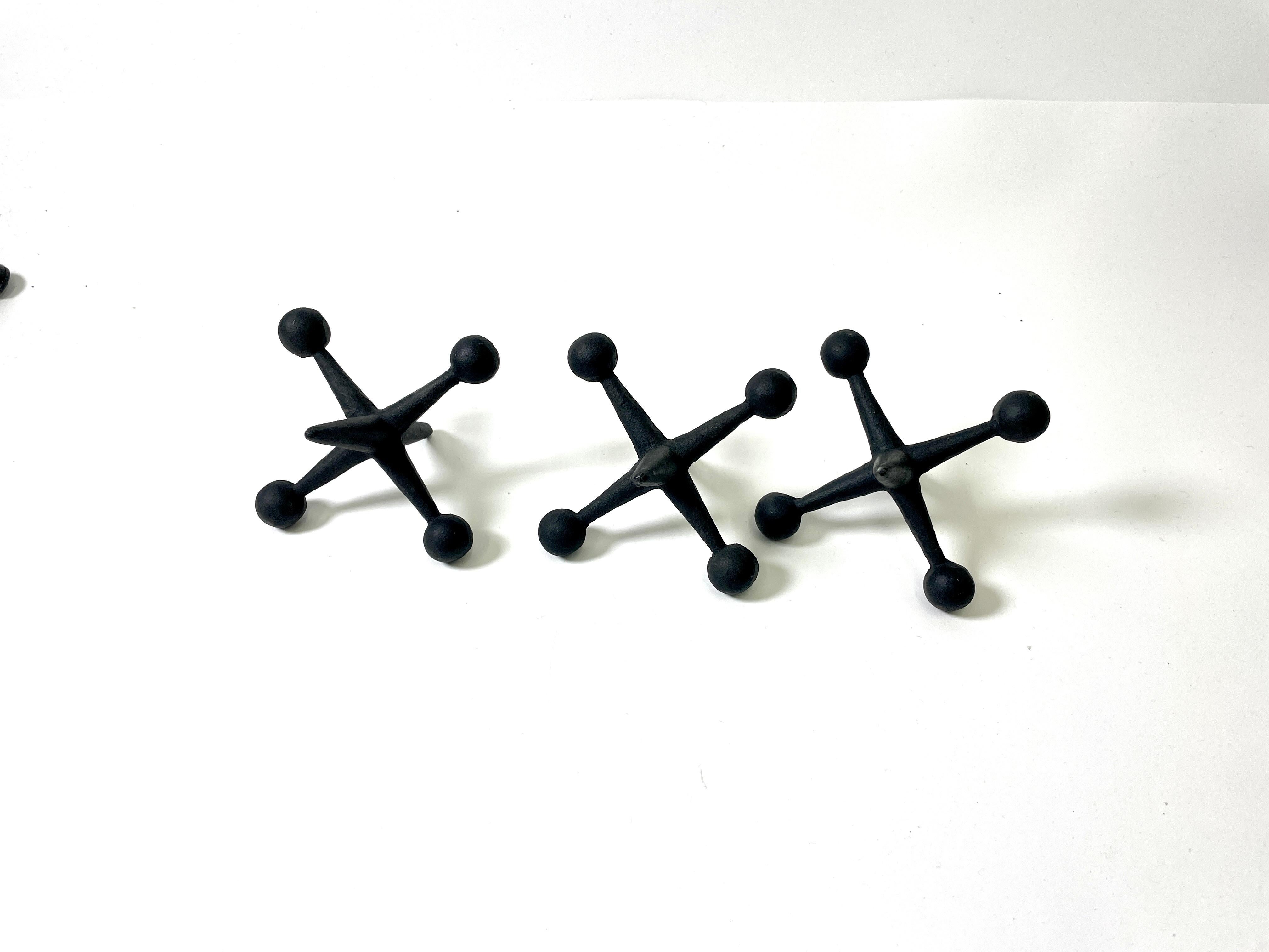 Mid-20th Century Set of Three Vintage Decorative Jacks made of iron with black lacque For Sale