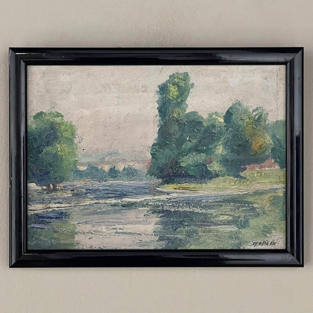Set of Three Vintage Framed Oil Paintings on Panel by Joseph Zabeau (1901-1978) are wonderful representations of the exquisite countryside around the storied region of Liege, with one emphasizing a beautiful river, another the roofline of a quaint