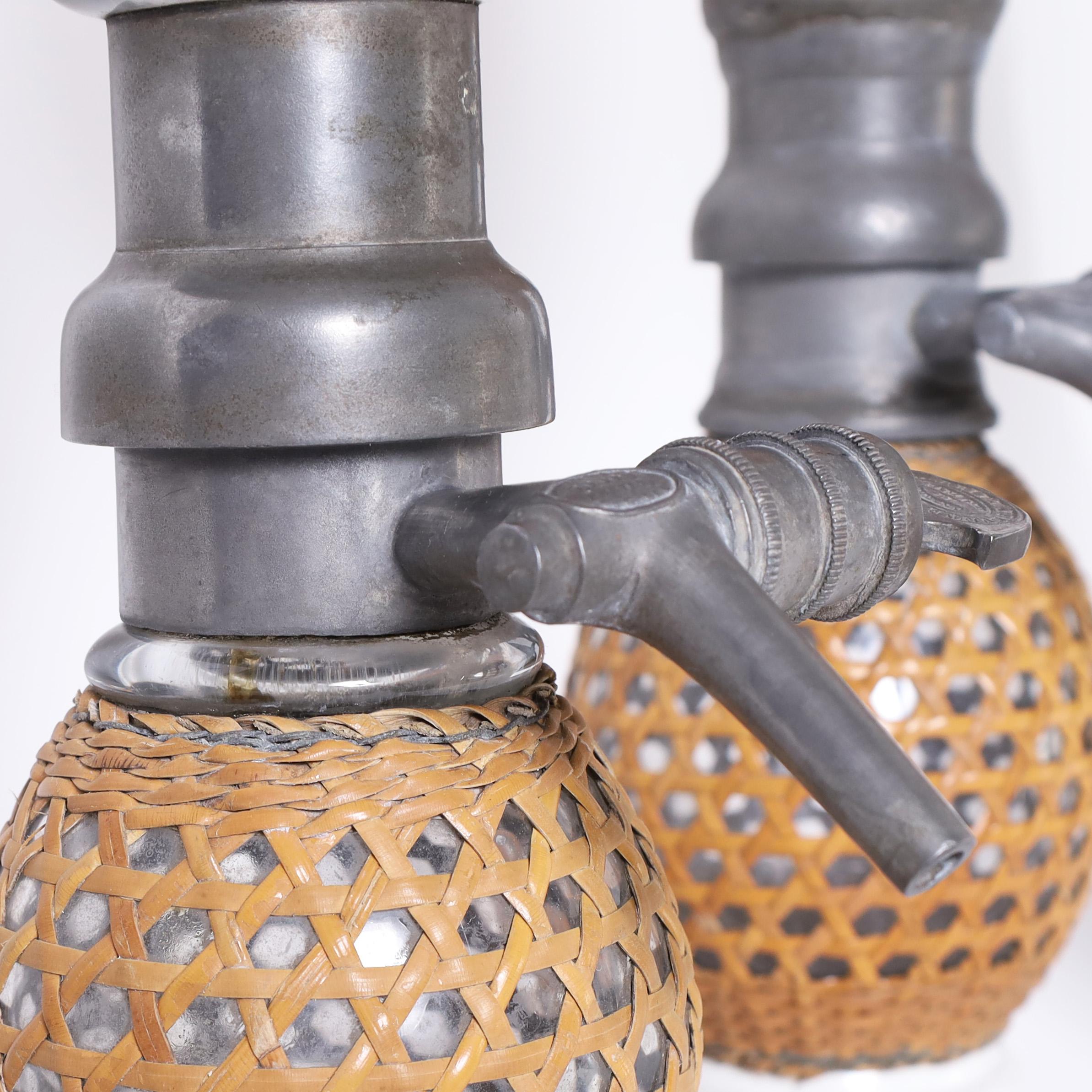 Hand-Crafted Set of Three Vintage French Caned Seltzer Bottles For Sale