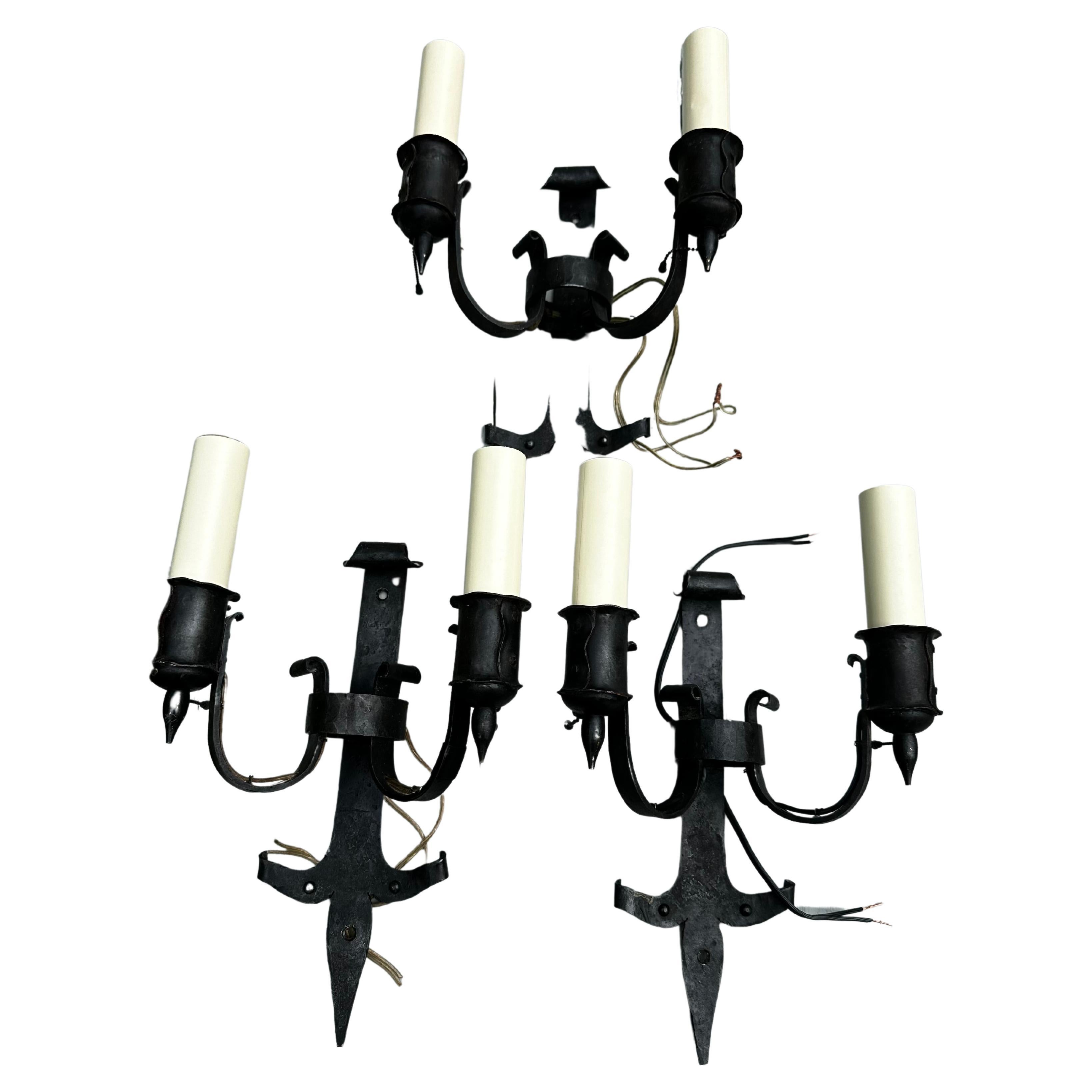 Set of three vintage iron and brass Bradley 
Hubbard tudor style. Wall sconces For Sale