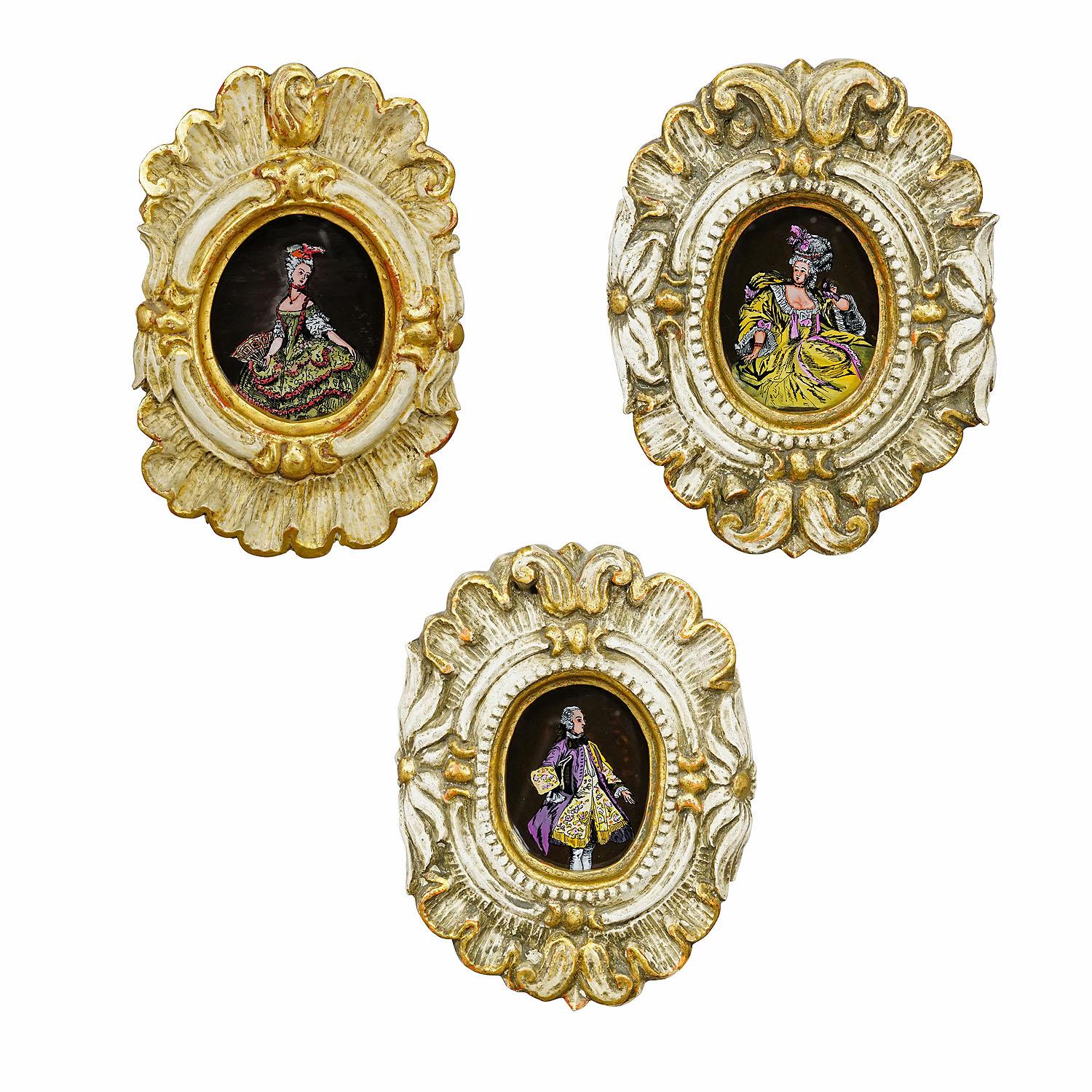 Set of Three Vintage Paintings with People in Rococo Costumes

A set of three paintings depicting two noble ladies and a noble man in Rococo costumes. Handpainted in Germany ca. 1950s and framed behind glass in wooden carved and gilded