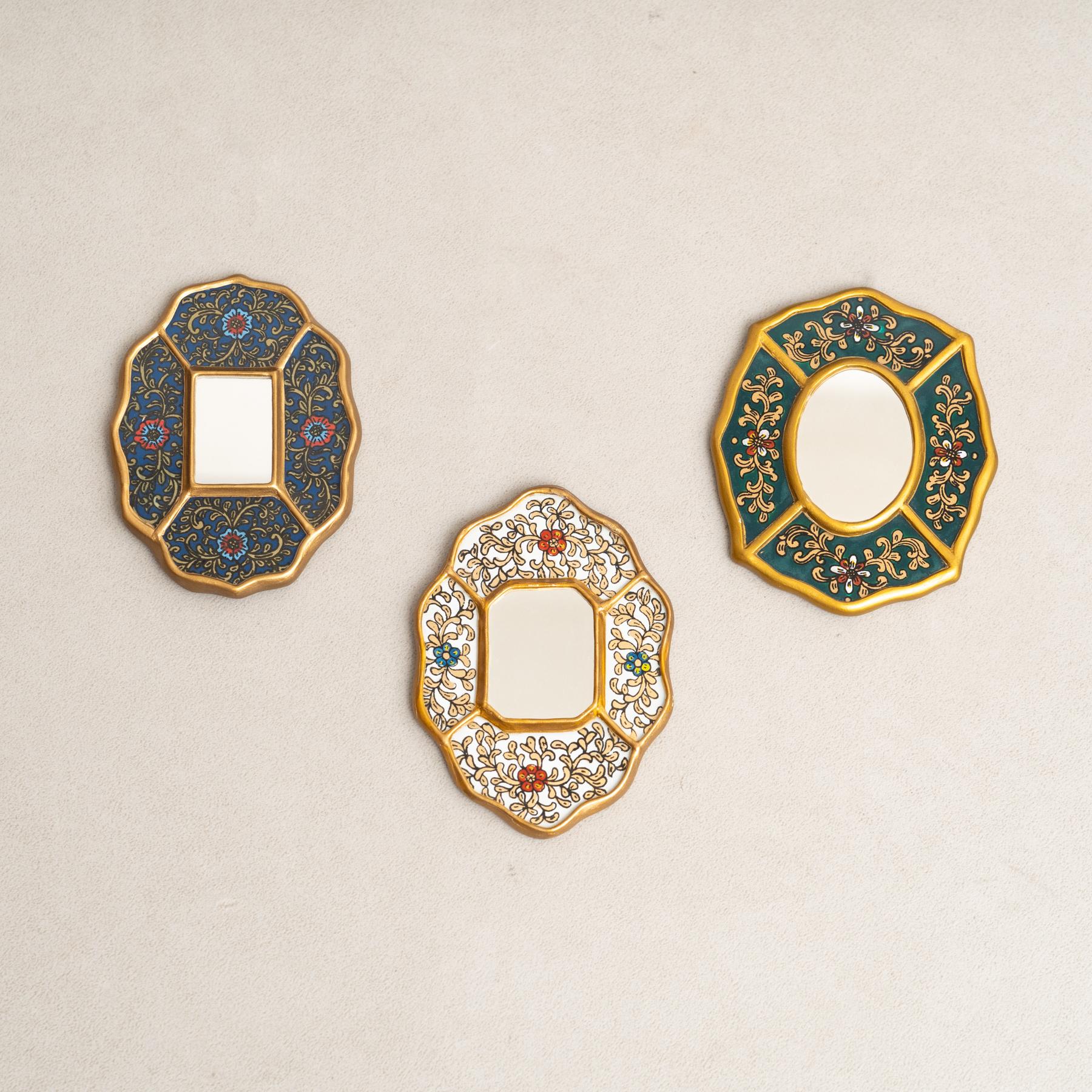 Set of Three Vintage Peruvian Mid-Century Hand-Painted Wooden Wall Mirrors.

Step into a time capsule of elegance with this captivating set of three small mirrors, hailing from 1960s Peru. Crafted with meticulous hand-painted details on wood, each