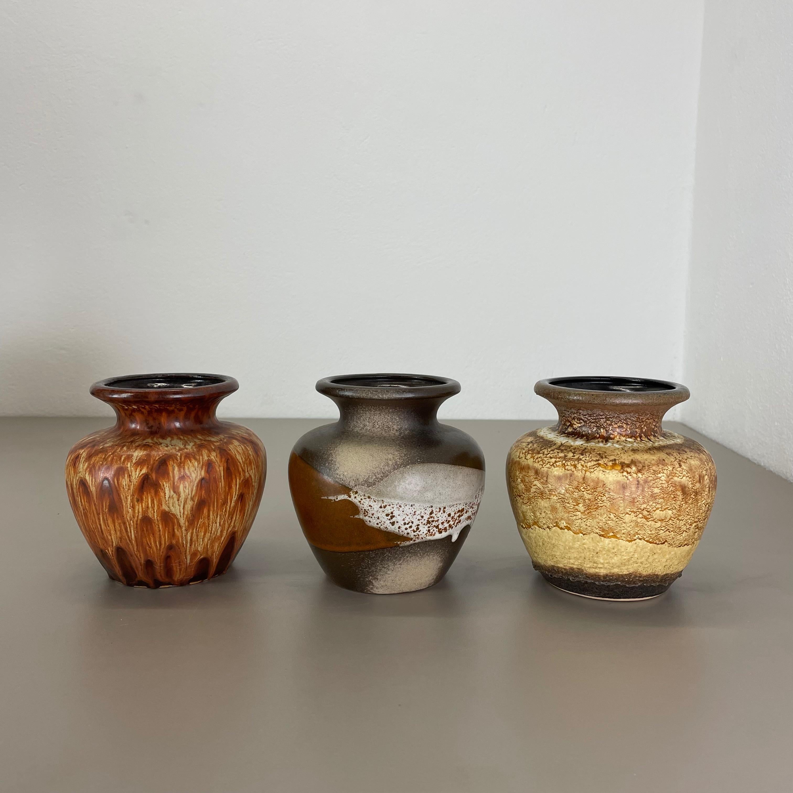 Article:

Set of three fat lava art vases


Producer:

Scheurich, Germany



Decade:

1970s


These original vintage vases was produced in the 1970s in Germany. It is made of ceramic pottery in fat lava optic. Super rare in this