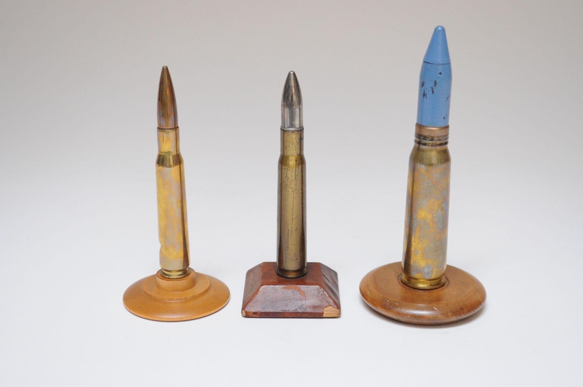 Mid-20th Century Set of Three Vintage Trench Art Bullet Casing Paperweights and Flint Lighter For Sale