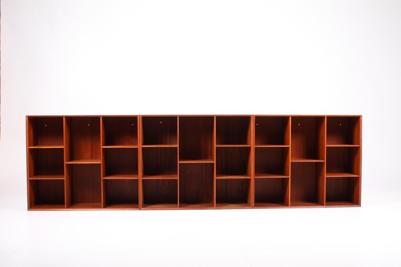 Set of 3 matching wall-mounted bookcases in solid teak. Designed by Peter Hvidt & Orla Mølgaard in 1960s. Made in Denmark. Great original condition.