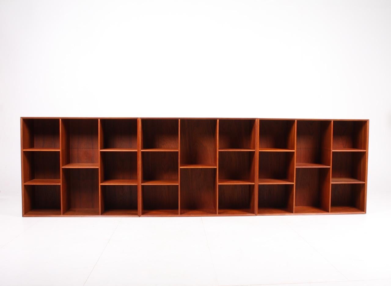 Set of 3 matching wall-mounted bookcases in solid teak. Designed by Peter Hvidt & Orla Mølgaard in 1960s. Made in Denmark. Great original condition.