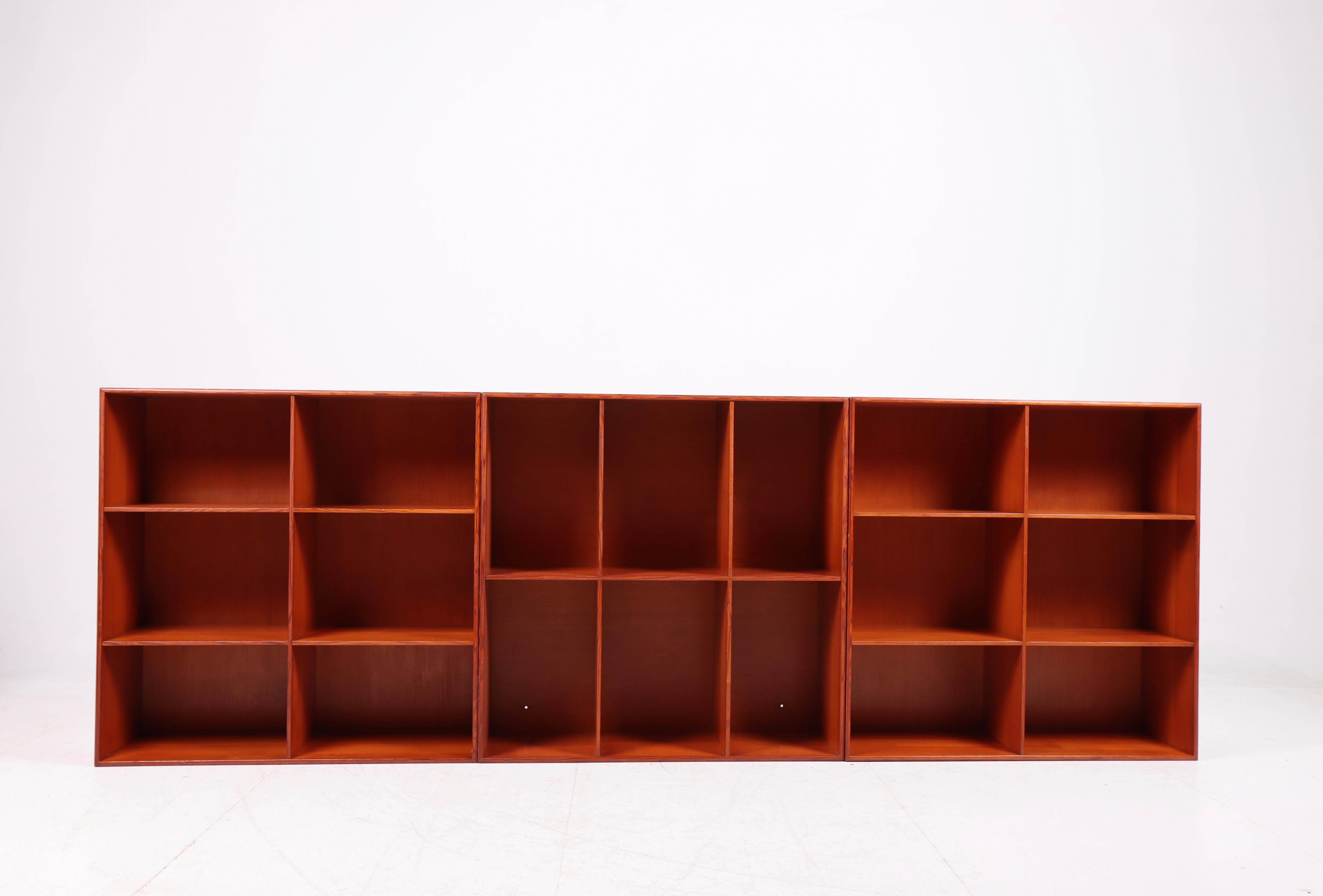 Set of three of wall-mounted units in solid Oregon Pine. Designed by Mogens Koch for Rud. Rasmussen cabinetmakers in 1933. Made in Denmark. Original condition.