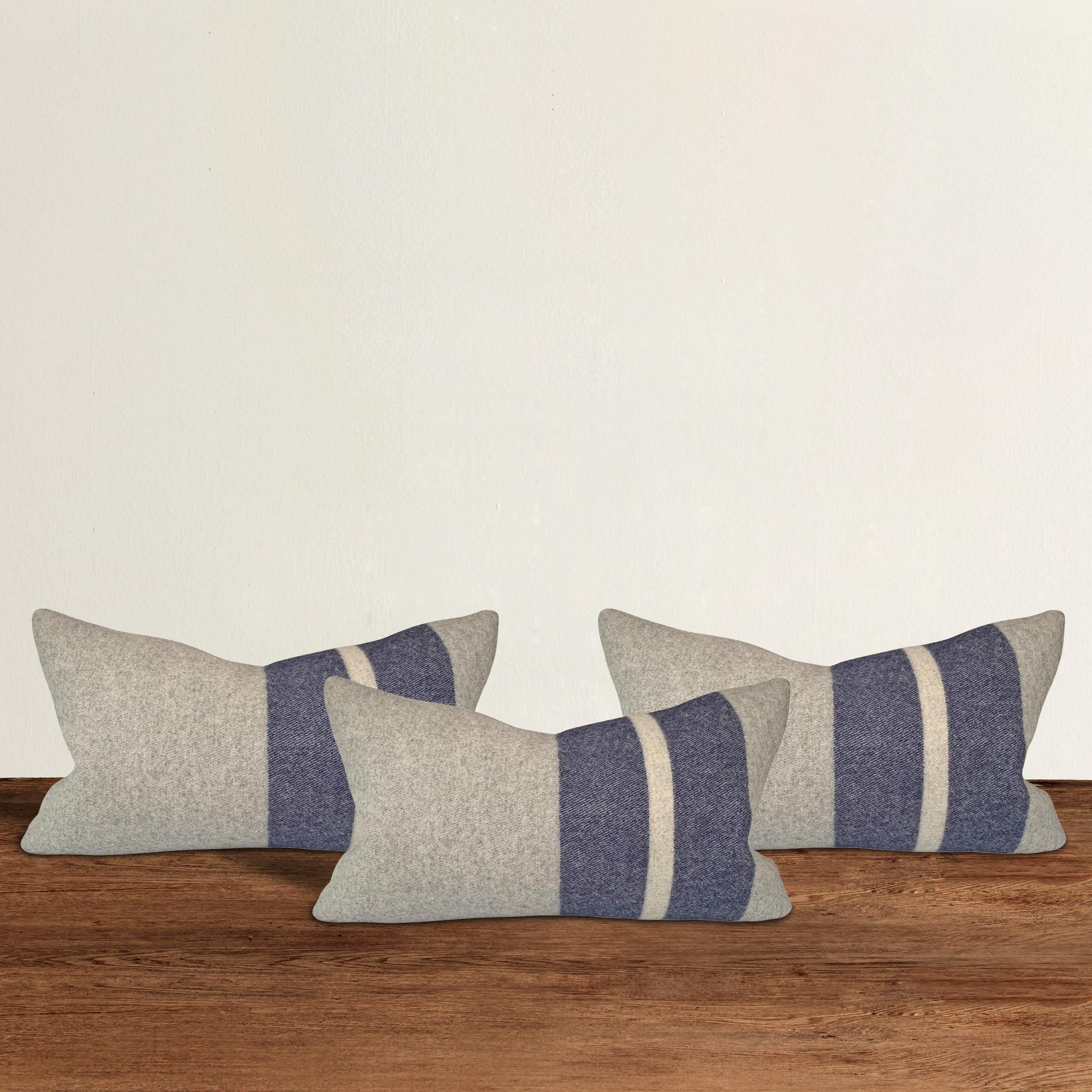 A wonderful set of three pillows with blue and white stripes, custom made from wool sourced from the Faribault Woolen Mills in Faribault, Minnesota. Faribault Woolen Mill was founded in 1865 along the Cannon River in Southeastern Minnesota, and