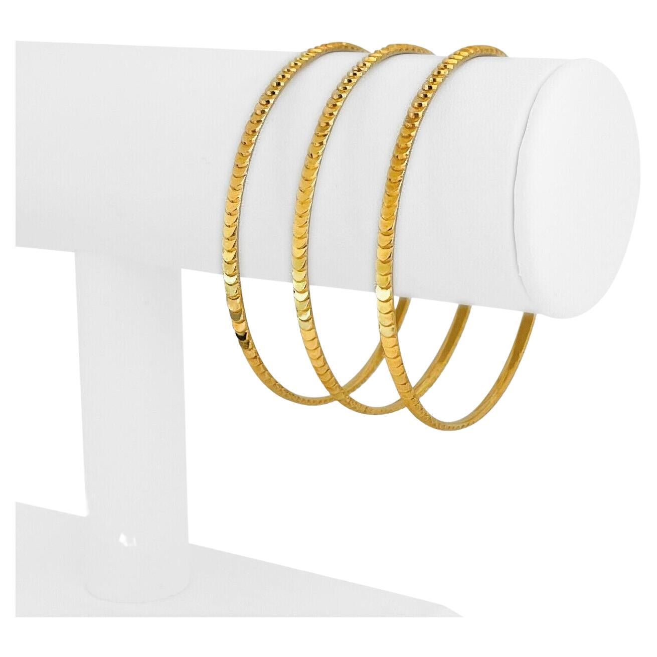 Set of Three 21 Karat Yellow Gold Diamond Cut Textured Bangle Bracelets