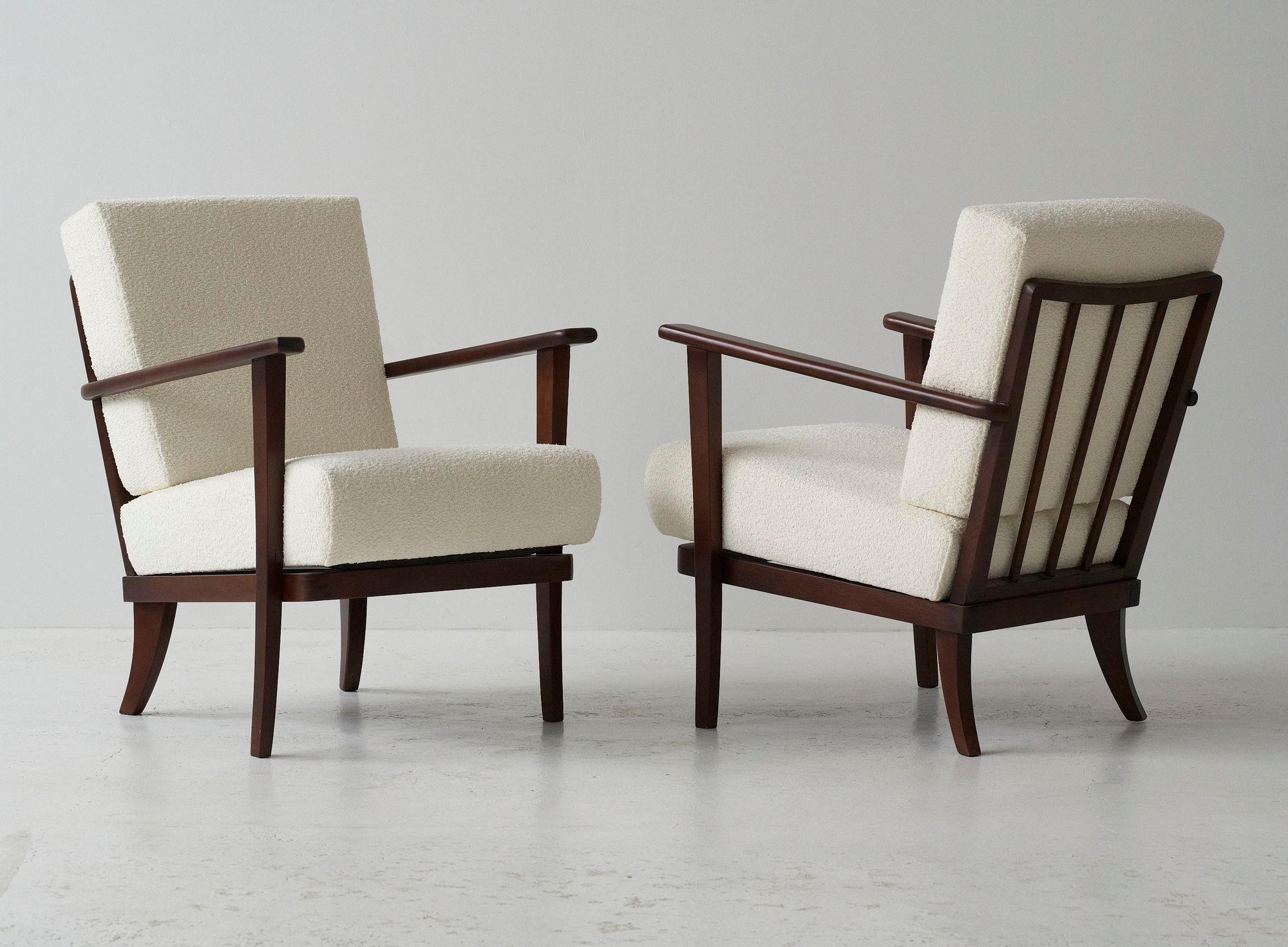 Set of 2 armchairs produced for TON during the 1960's in former Czechoslovakia., as many of TON's furniture has been. 
Wooden frame cleaned, varnished, lacquered. Seating recreated and reupholstered in a creme boucle fabric.