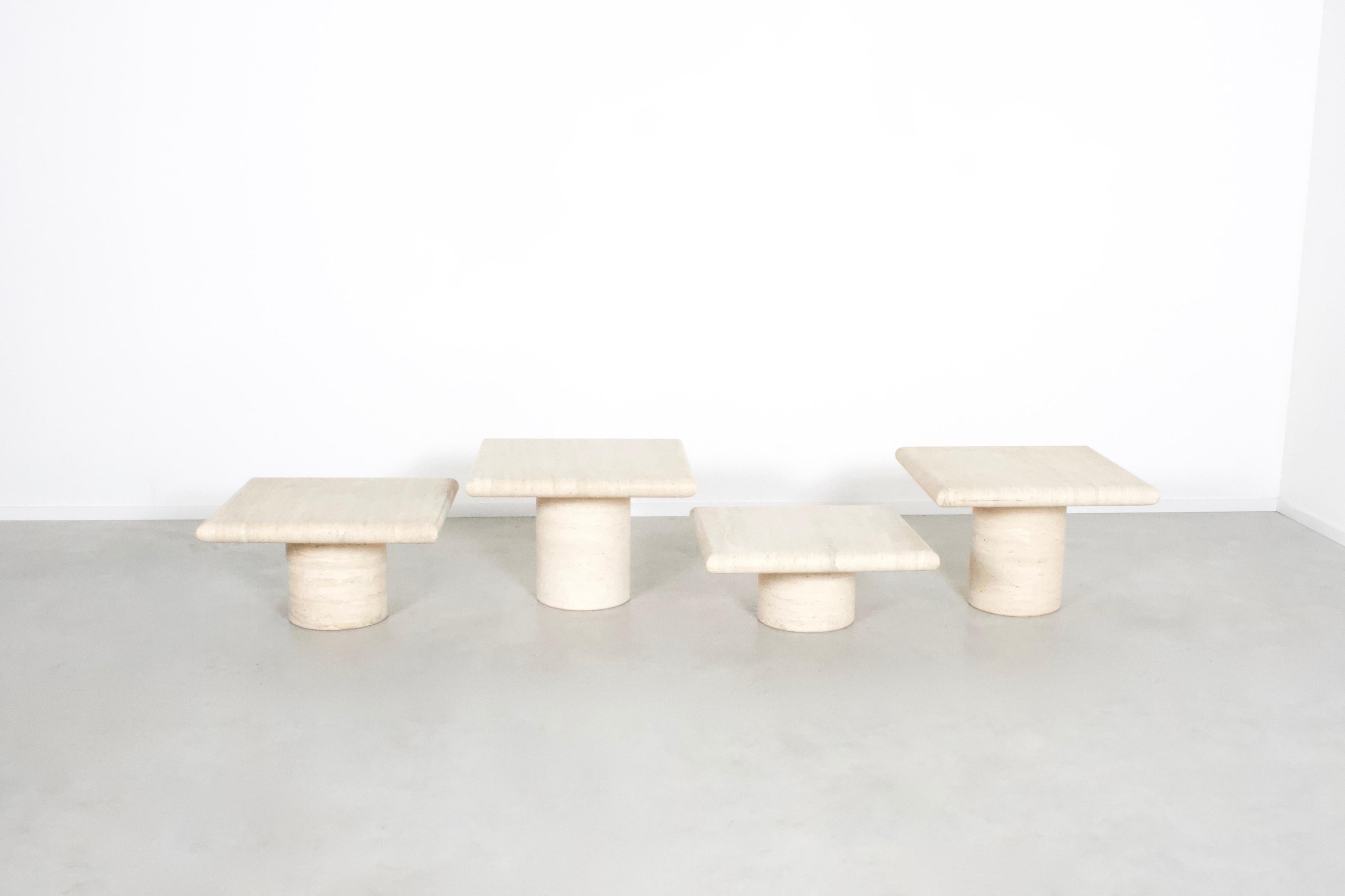 Set of four travertine tables in very good condition.

Manufactured by Up&Up in the 1970s in Italy.

The tables have a thick solid travertine top with rounded edges.

The bases of the tables are round and also made of travertine.

They have