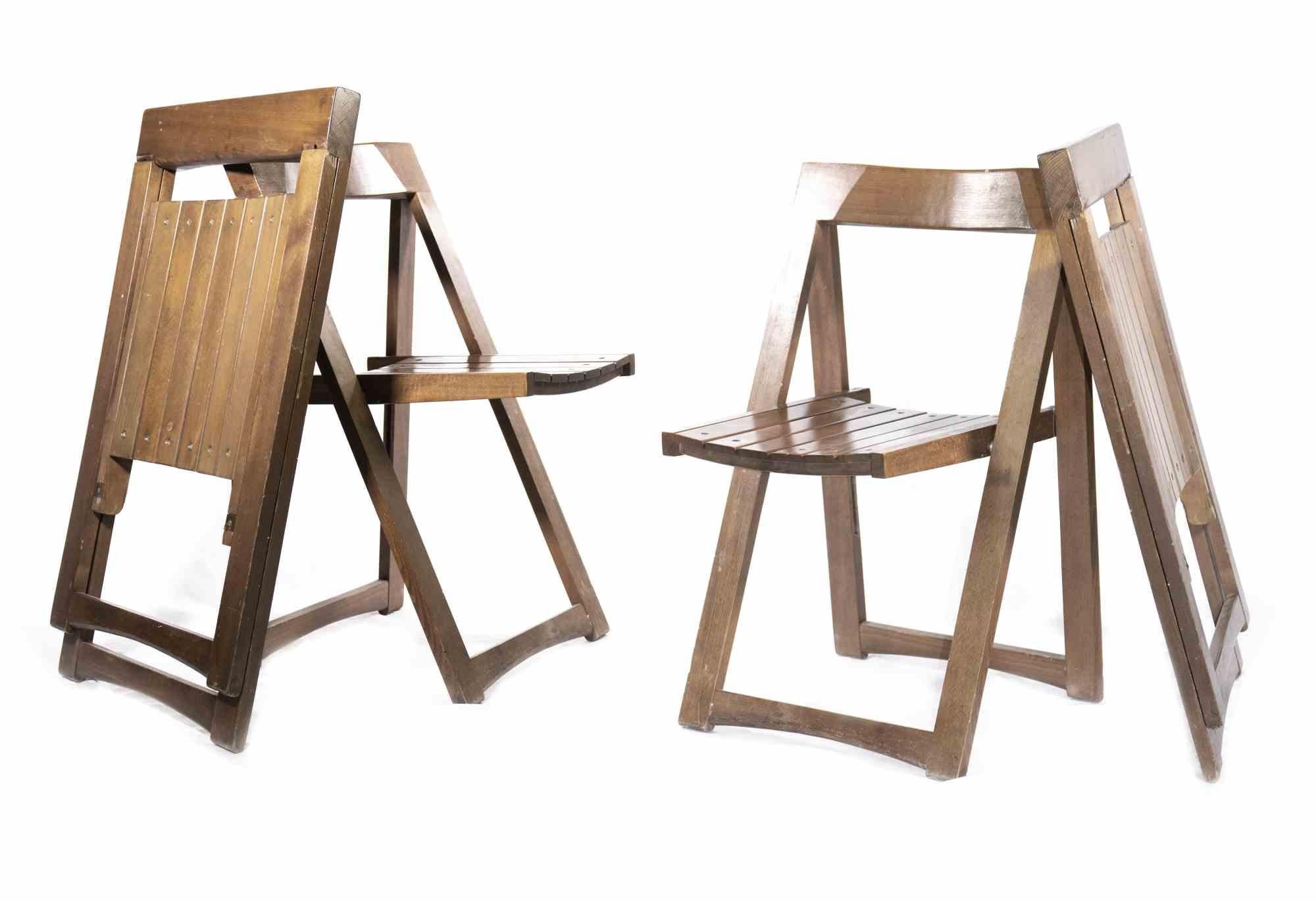 Set of Trieste chairs is an original furniture seating set realized in the style of Aldo Jacober in the 1960s.

Model Trieste. Produced by Bazzani. The set is composed by 4 chairs, entirely realized in wood.

Dimensions: 76 x 45 x 47 cm (each