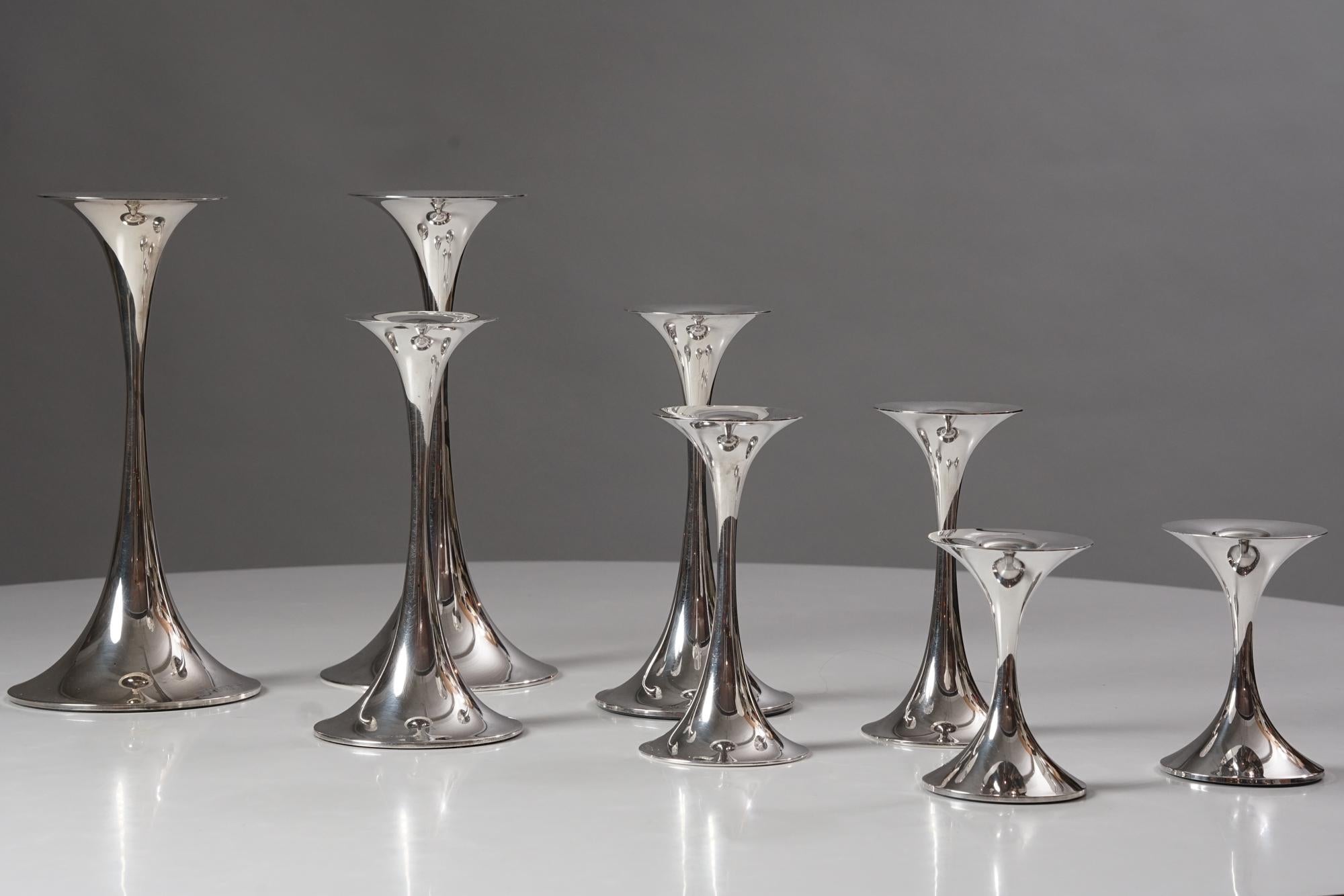 Set of trumpet candle holders, designed by Tapio Wirkkala, manufactured by Kultakeskus Oy, Mid-20th Century. Silver. Marked and signed. The set includes eight candle holders. Good vintage condition, minor patina and wear consistent with age and