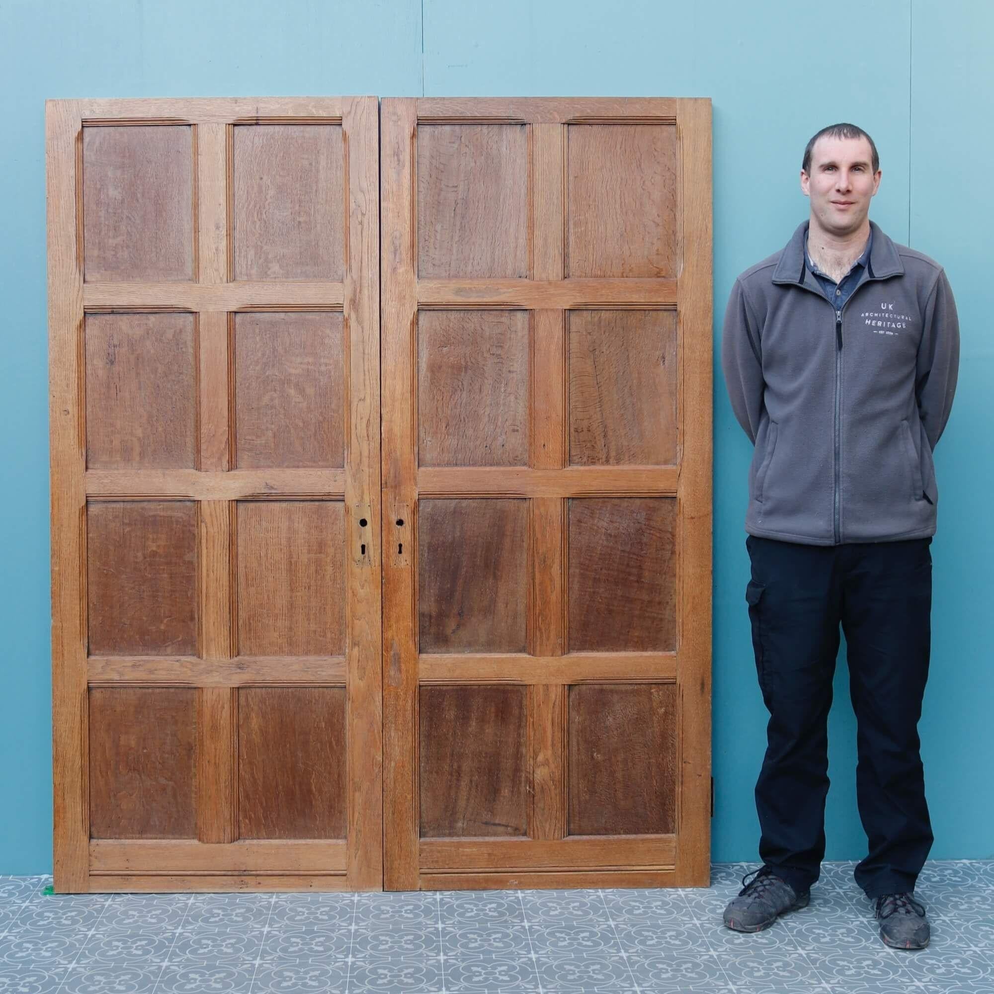 Though dating from the late 19th century Victorian era, these oak room dividing doors encompass a range of styles including Tudor, Jacobean and Georgian. These 130-year-old oak double doors are handsomely crafted, each with 8-panels to both sides